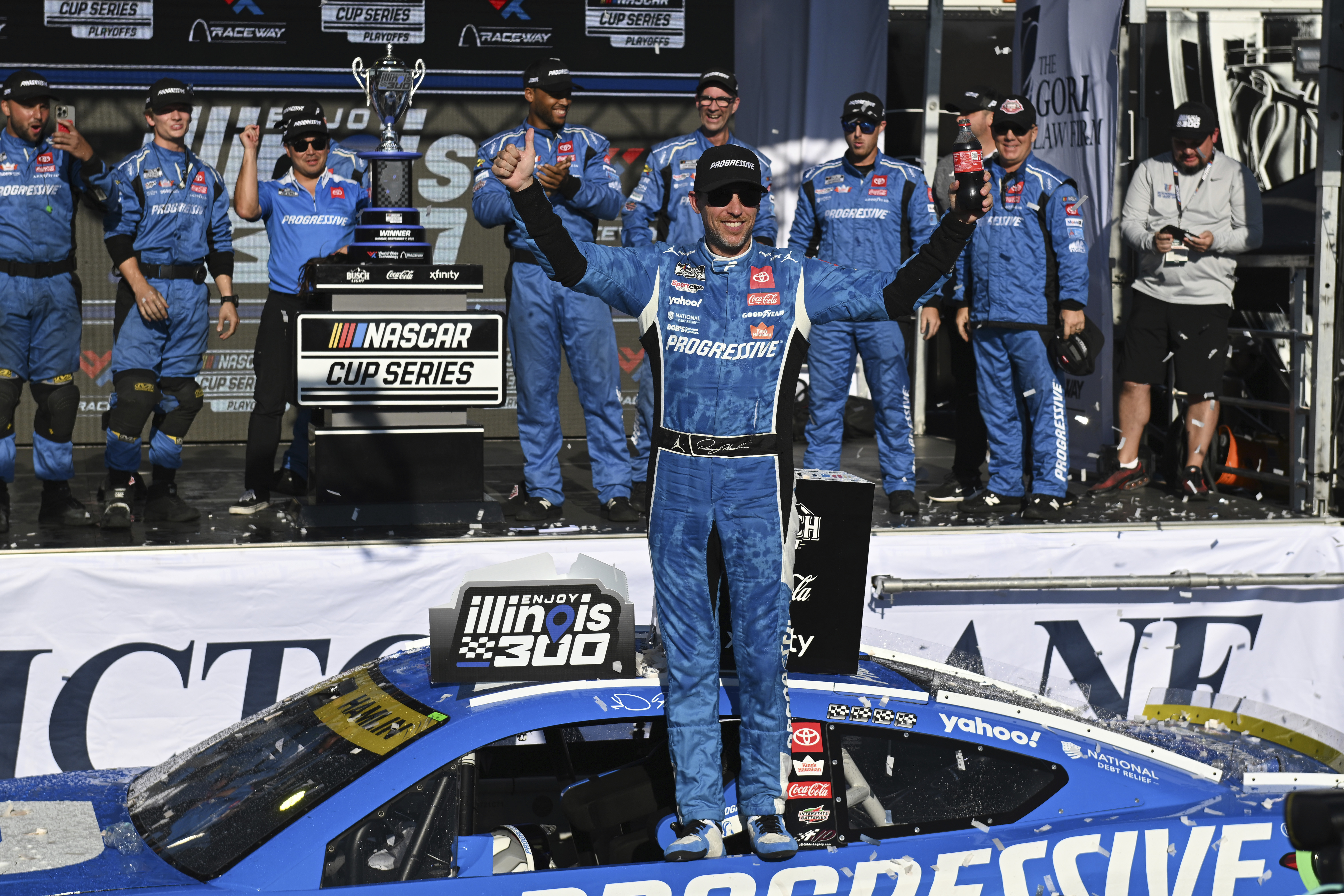 Denny Hamlin, center, celebrates after winning a NASCAR Cup Series auto race at World Wide Technology Raceway, Sunday, Sept. 7, 2025, in Madison, Ill. 