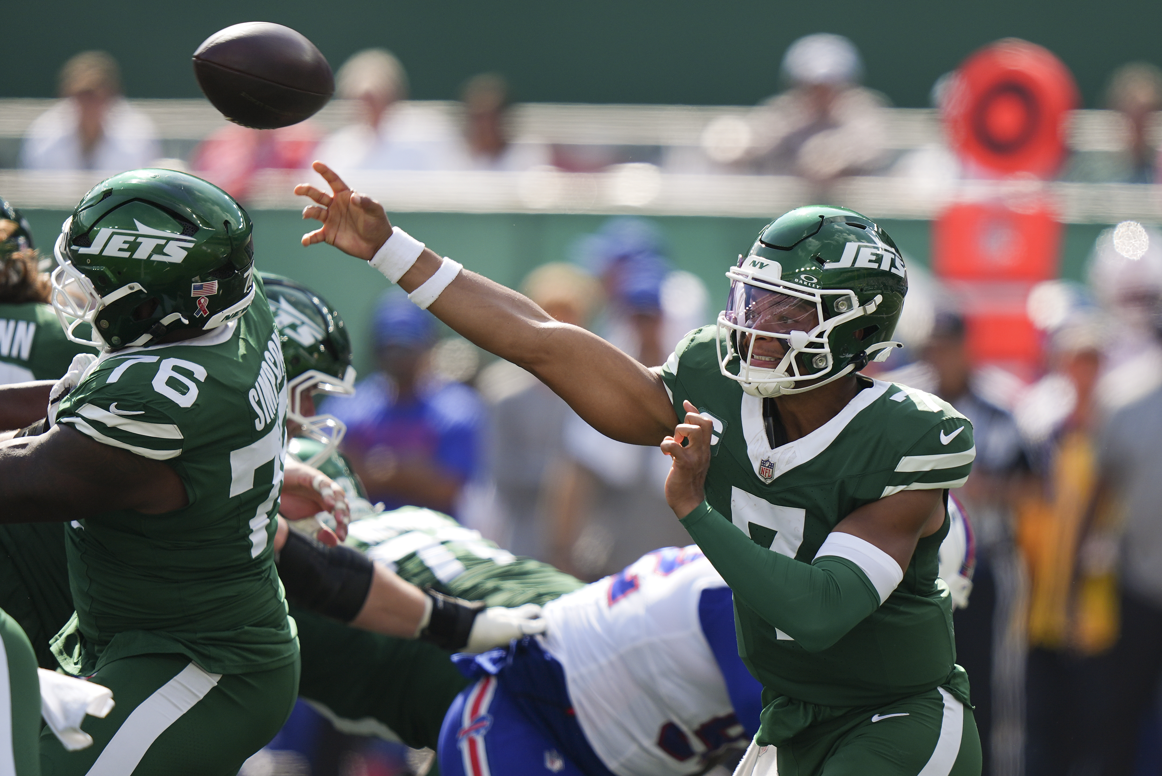New York Jets quarterback Justin Fields (7) passes against the Buffalo Bills during the third quarter of an NFL football game, Sunday, Sept. 14, 2025, in East Rutherford, N.J. 
