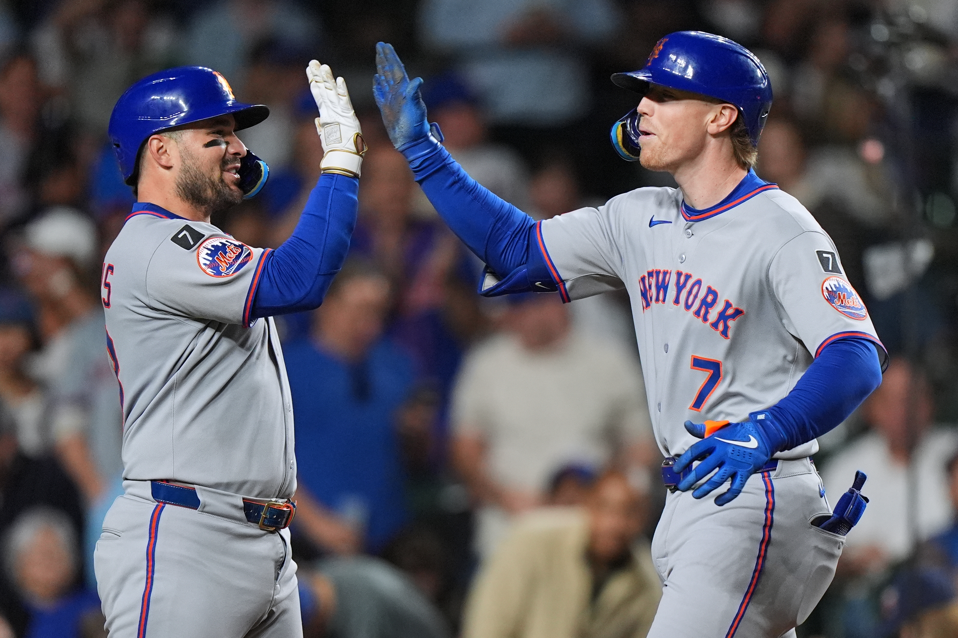 New York Mets' Brett Baty, right, celebrates with Luis Torrens after hitting a three-run home run during the fourth inning of a baseball game against the Chicago Cubs in Chicago, Thursday, Sept. 25, 2025. 