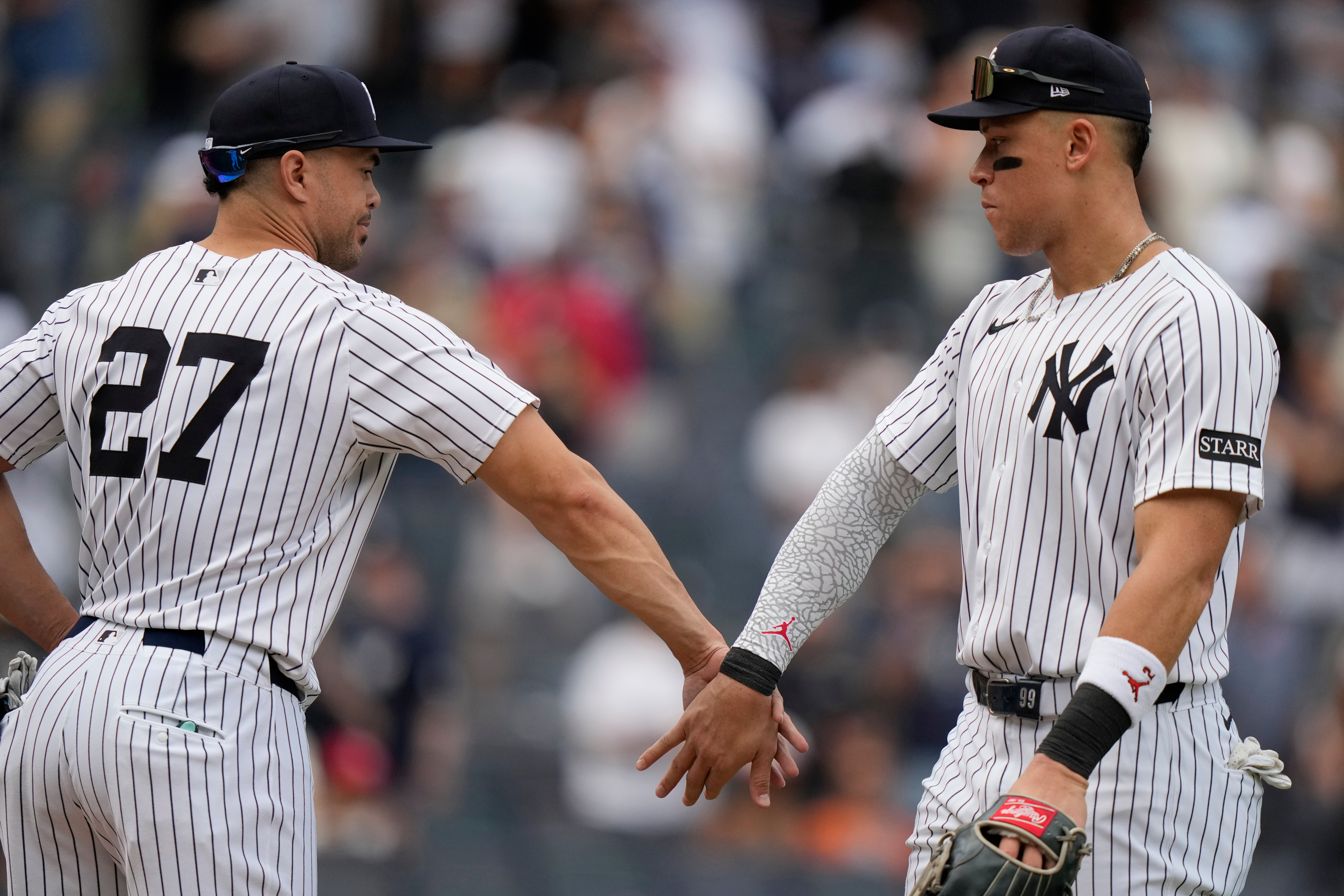 New York Yankees' Giancarlo Stanton, left, celebrates with Aaron Judge after a baseball game against the Baltimore Orioles Saturday, Sept. 27, 2025, in New York. 