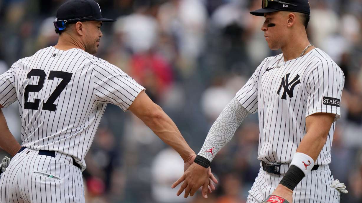 New York Yankees' Giancarlo Stanton, left, celebrates with Aaron Judge after a baseball game against the Baltimore Orioles Saturday, Sept. 27, 2025, in New York.