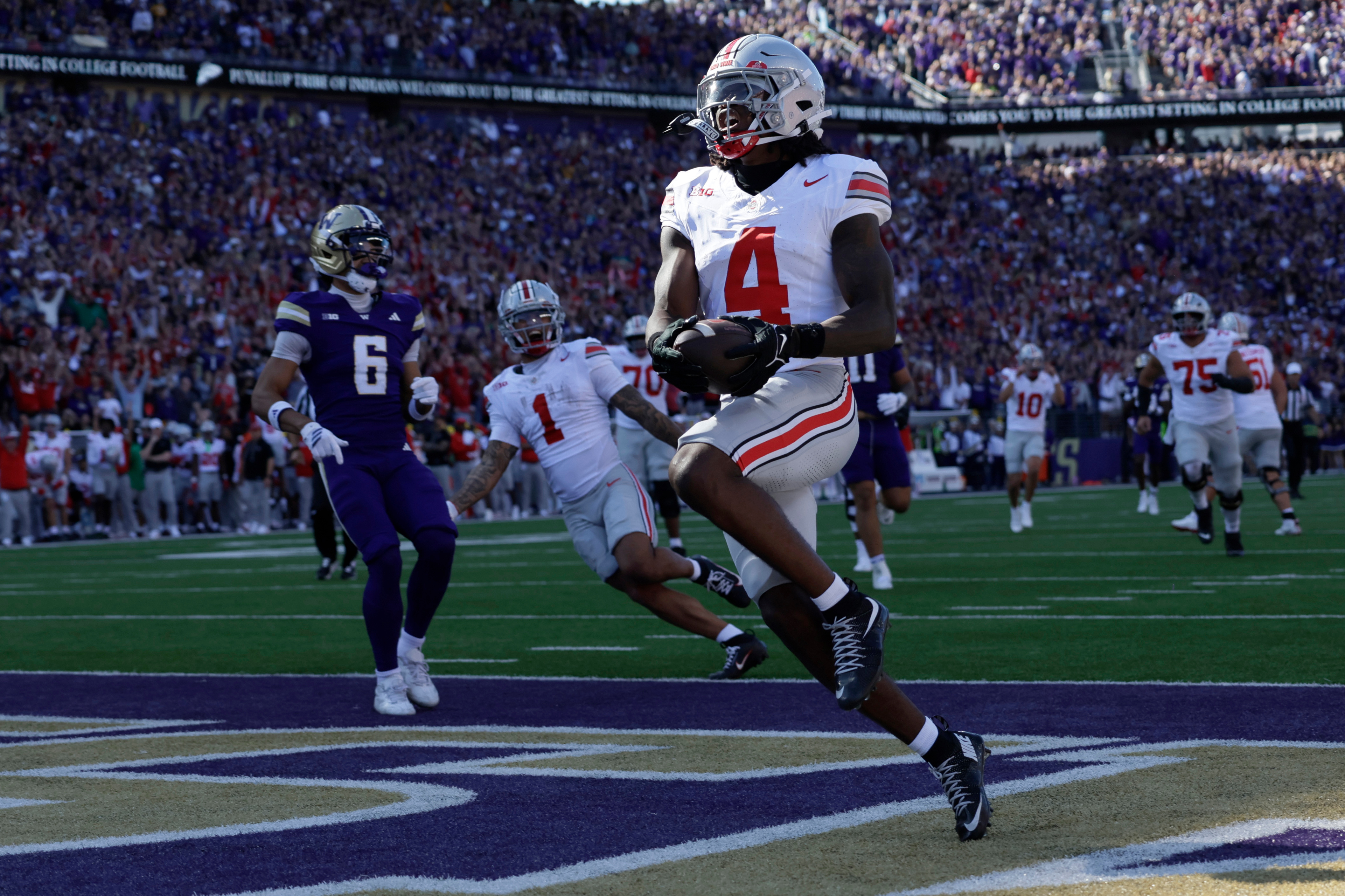 Ohio State wide receiver Jeremiah Smith (4) scores on a pass run play against the Washington during the first half of an NCAA college football game, Saturday, Sept. 27, 2025, in Seattle. 