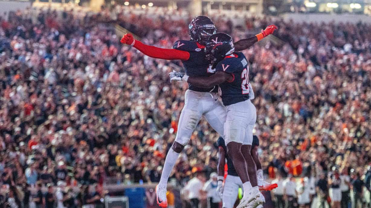 Virginia running back Xavier Brown (20) Virginia wide receiver Andre Greene Jr. (2) celebrate after a touchdown during the second half of an NCAA college football game, Friday, Sept. 26 2025, in Charlottesville, Va.