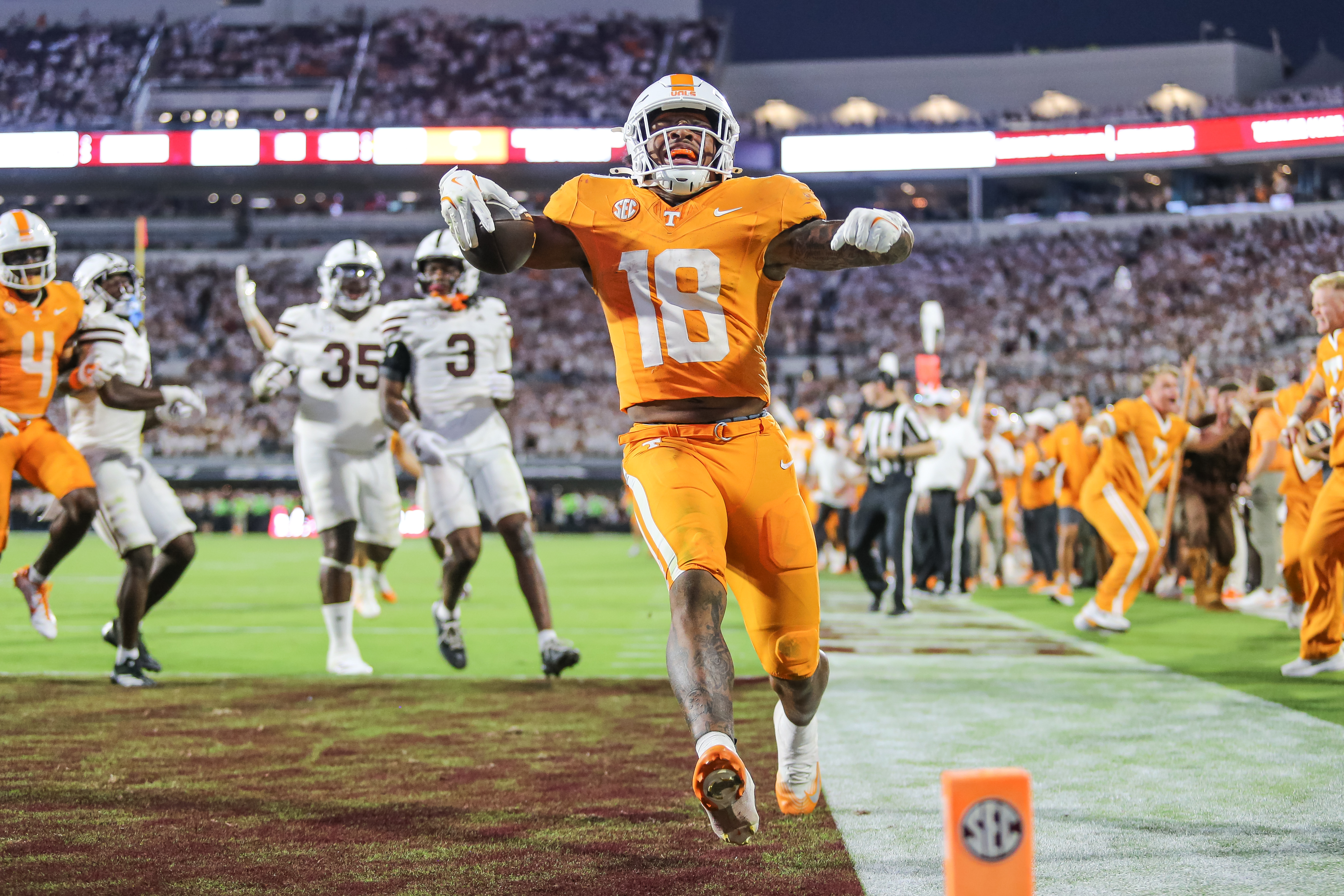 Tennessee running back DeSean Bishop (18) scores the go-ahead touchdown against Mississippi State during the overtime of an NCAA college football game in Starkville, Miss., Saturday, Sept. 27, 2025. 