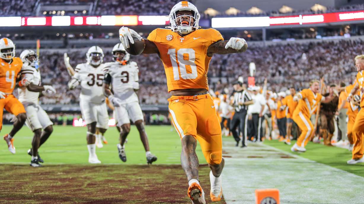 Tennessee running back DeSean Bishop (18) scores the go-ahead touchdown against Mississippi State during the overtime of an NCAA college football game in Starkville, Miss., Saturday, Sept. 27, 2025.