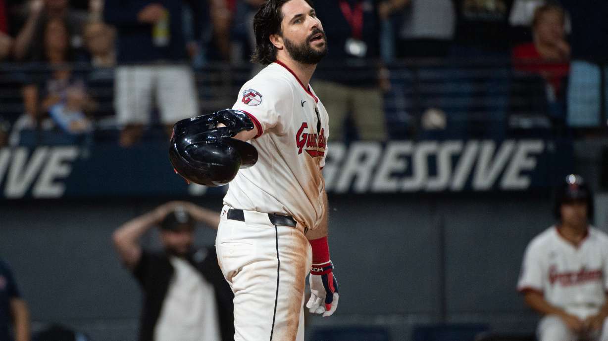 Cleveland Guardians' Austin Hedges reacts after being called out on strikes from Texas Rangers starting pitcher Jacob Latz to end the fifth inning of a baseball game, Saturday, Sept. 27, 2025, in Cleveland.