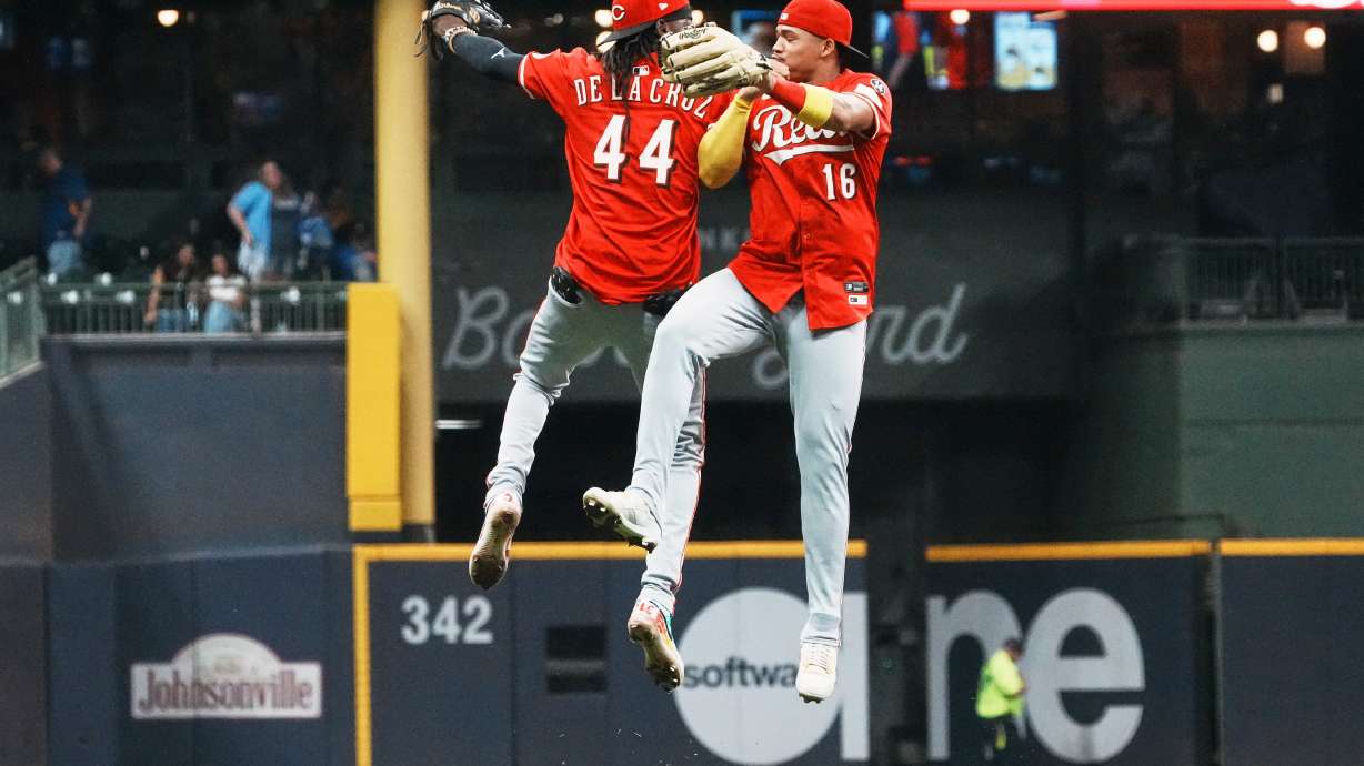 Cincinnati Reds' Elly De La Cruz and Noelvi Marte celebrate after a baseball game against the Milwaukee Brewers Saturday, Sept. 27, 2025, in Milwaukee.