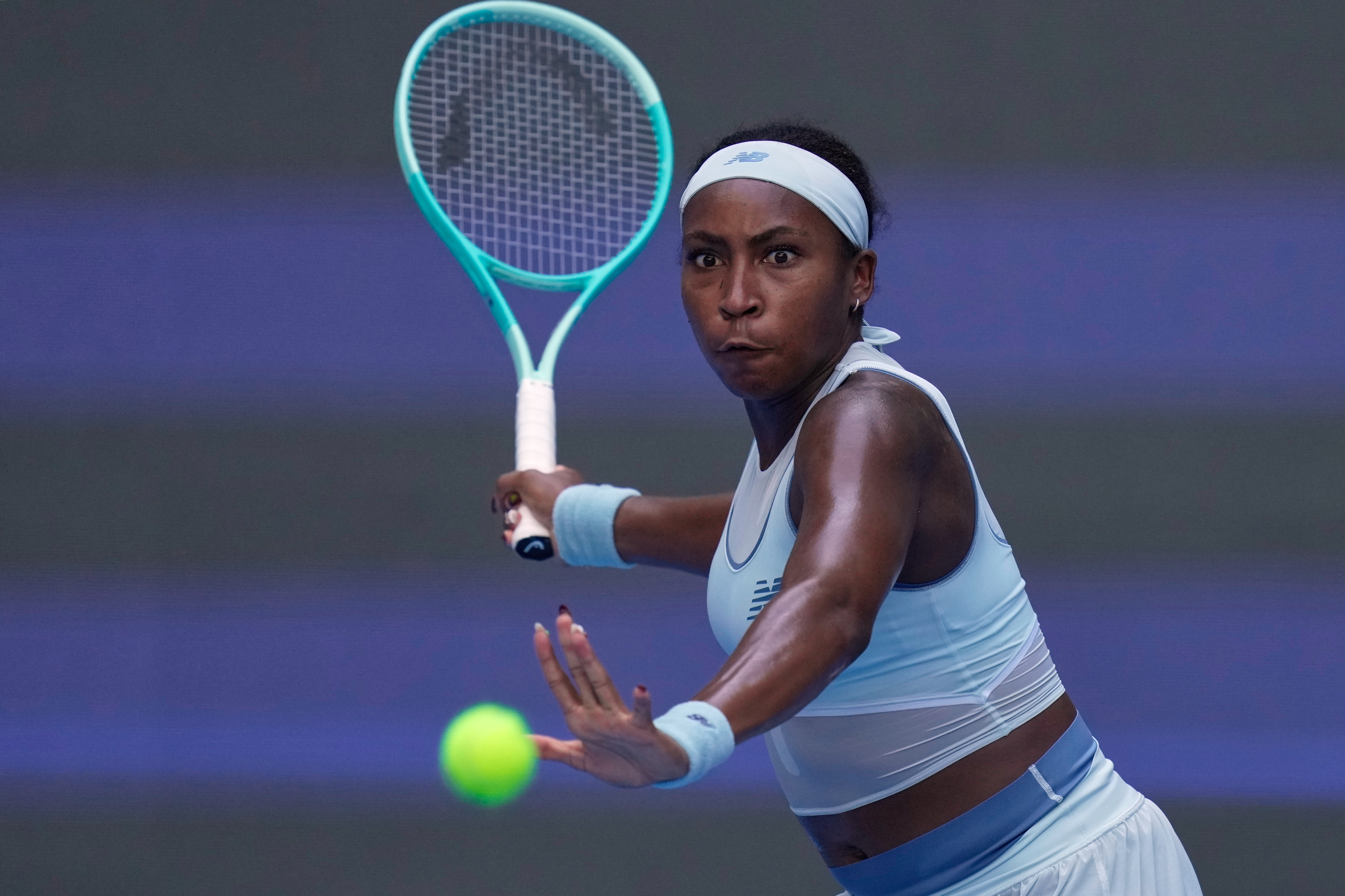 Coco Gauff of the United States plays a forehand return to Leylah Fernandez of Canada during the women's singles match for the China Open tennis tournament at the National Tennis Center in Beijing, China, Sunday, Sept. 28, 2025.