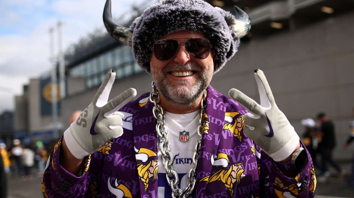 A supporter poses for photographers before the start of the NFL football game between Minnesota Vikings and Pittsburgh Steelers at Croke Park stadium in Dublin, Sunday, Sept. 28, 2025.