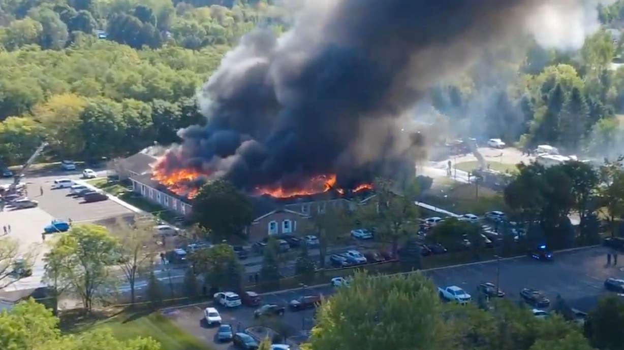 Massive flames and smoke rise from a meetinghouse of The Church of Jesus Christ of Latter-day Saints in Grand Blanc, about 50 miles north of Detroit, Mich., on Sunday.