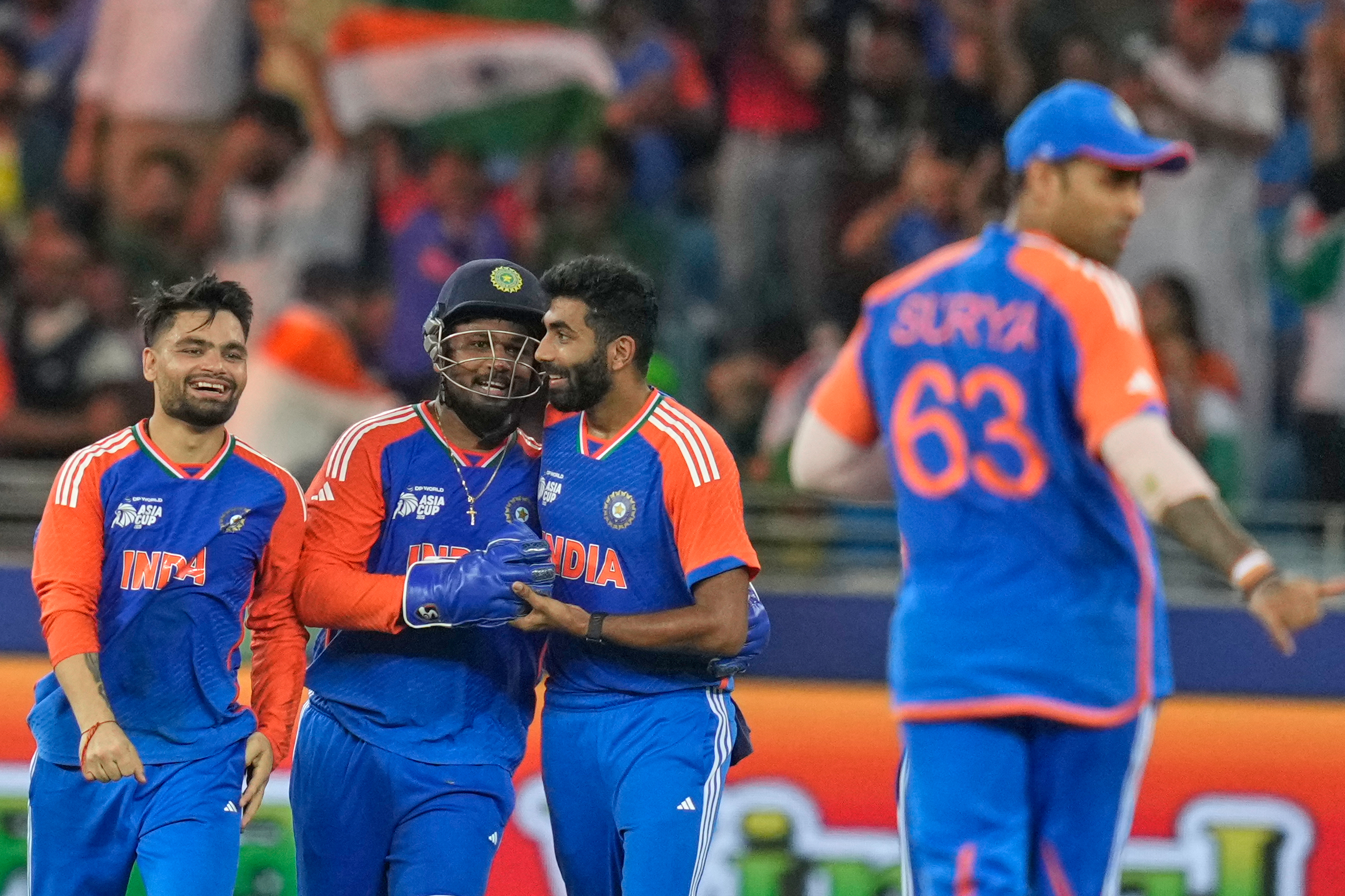 Indian players celebrate the wicket of Pakistan's captain Salman Agha during the Asia Cup cricket final between India and Pakistan at Dubai International Cricket Stadium, United Arab Emirates, Sunday, Sept. 28, 2025.