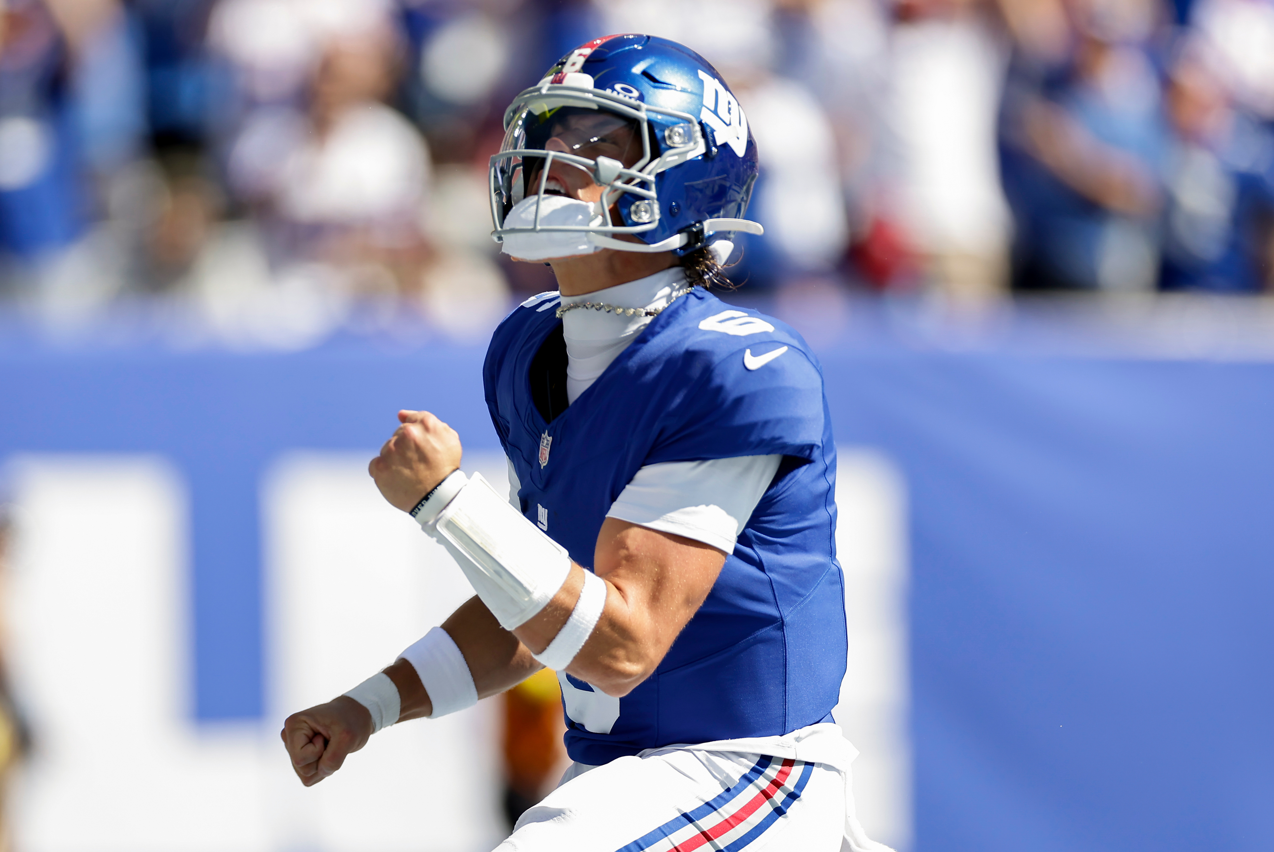New York Giants quarterback Jaxson Dart (6) reacts after scoring a touchdown against the Los Angeles Chargers during the first quarter of an NFL football game, Sunday, Sept. 28, 2025, in East Rutherford, N.J. 