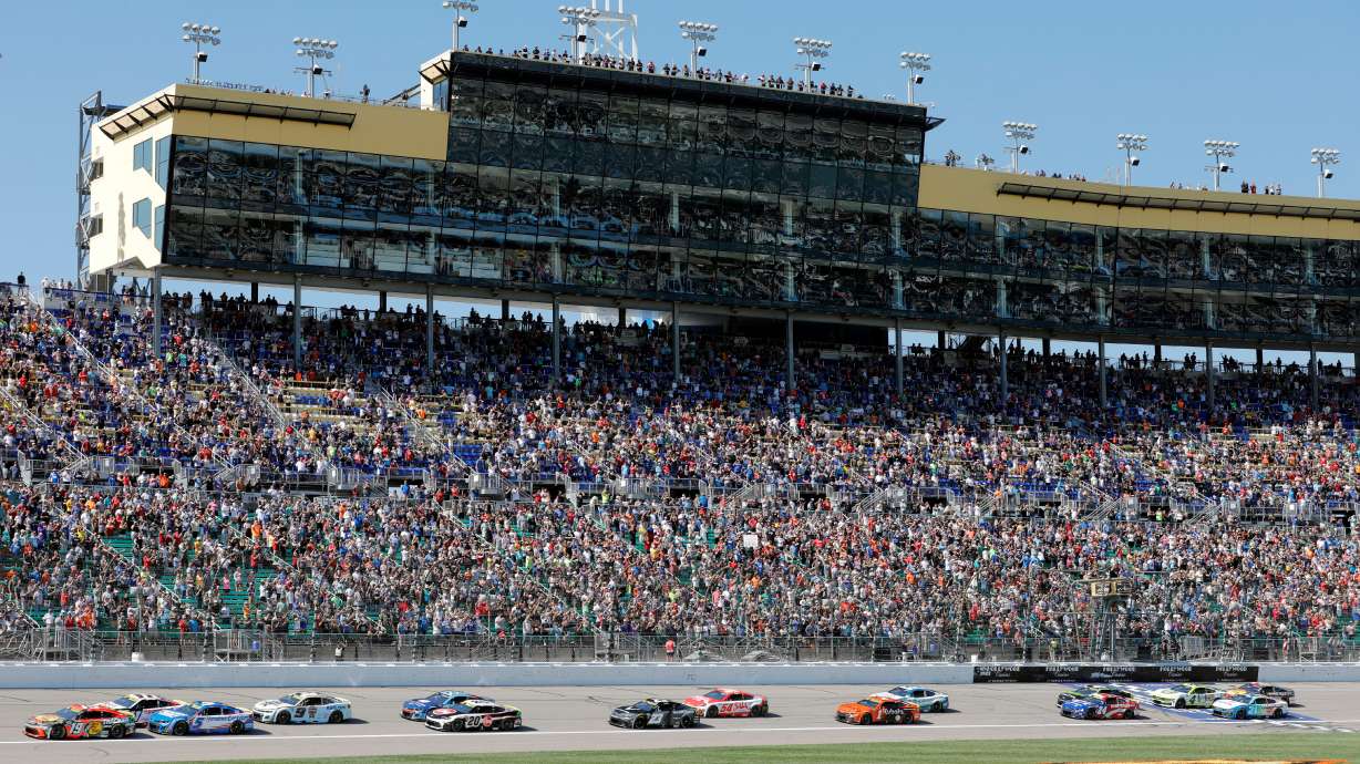 Drivers head toward Turn 1 at the start of a NASCAR Cup Series auto race at Kansas Speedway in Kansas City, Kan., Sunday, Sept. 28, 2025.