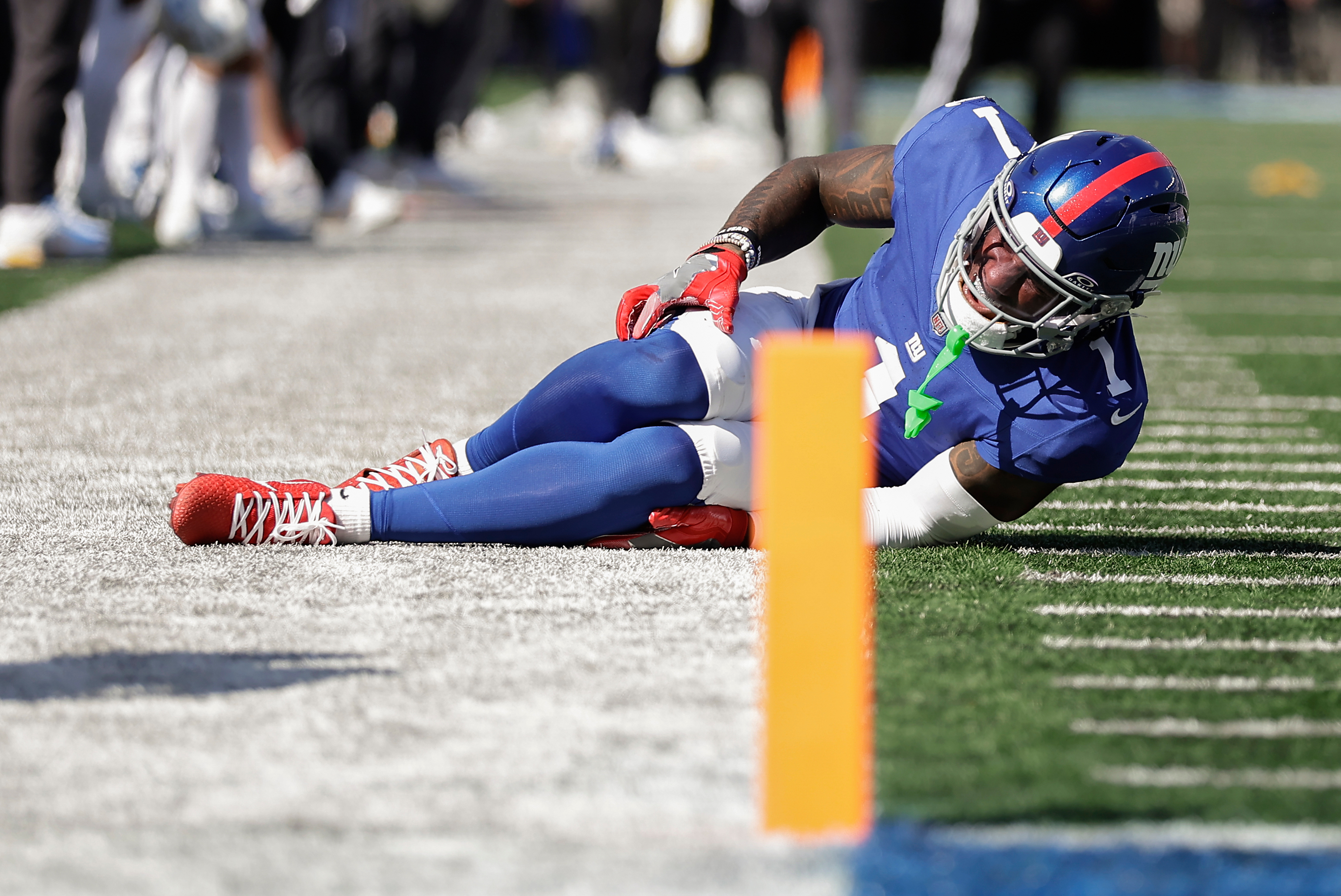 New York Giants wide receiver Malik Nabers (1) reacts to an injury during the second quarter of an NFL football game against the Los Angeles Chargers, Sunday, Sept. 28, 2025, in East Rutherford, N.J. 
