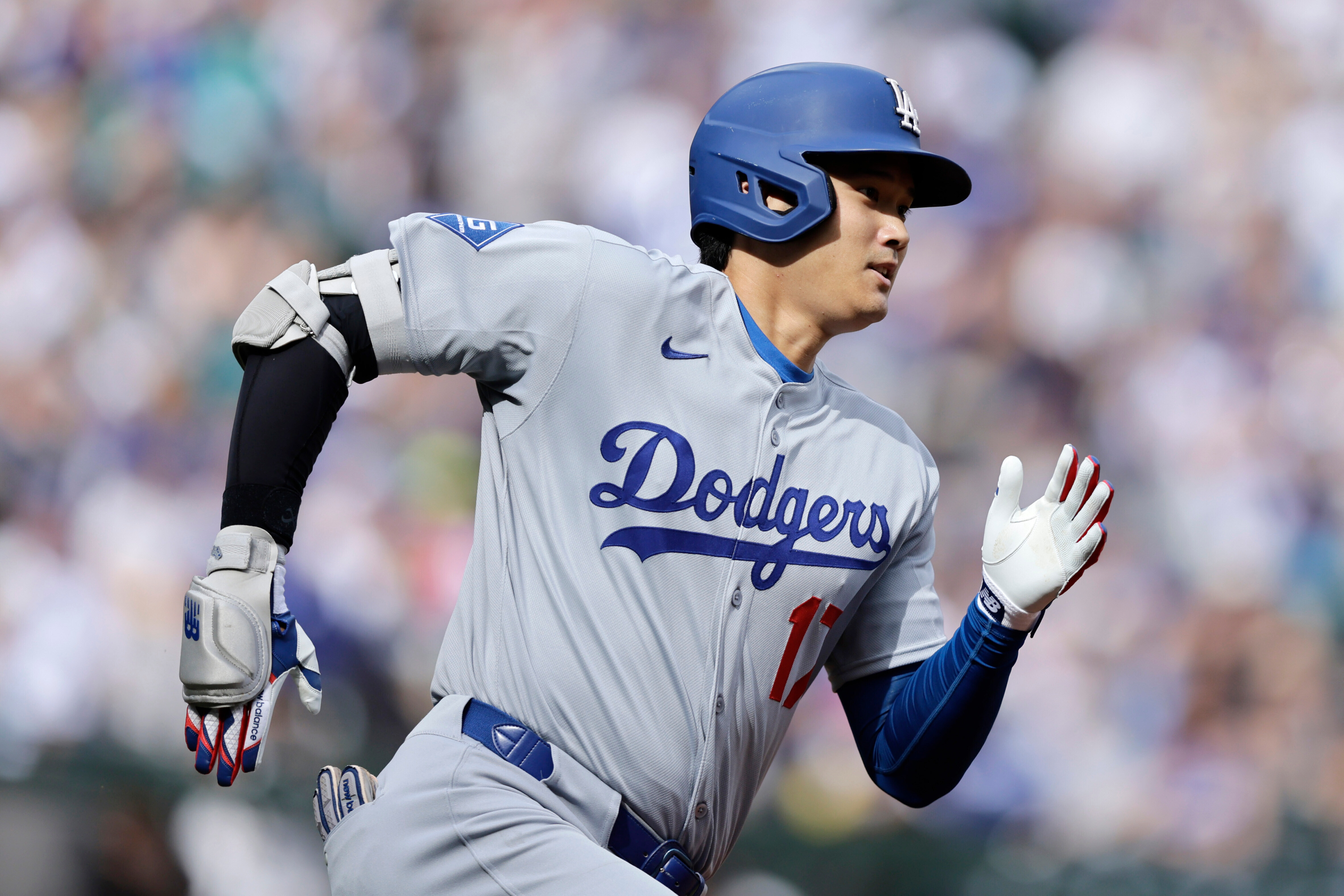 Los Angeles Dodgers Shohei Ohtani runs toward first base as he doubles against the Seattle Mariners during a baseball game, Sunday, Sept. 28, 2025, in Seattle. 