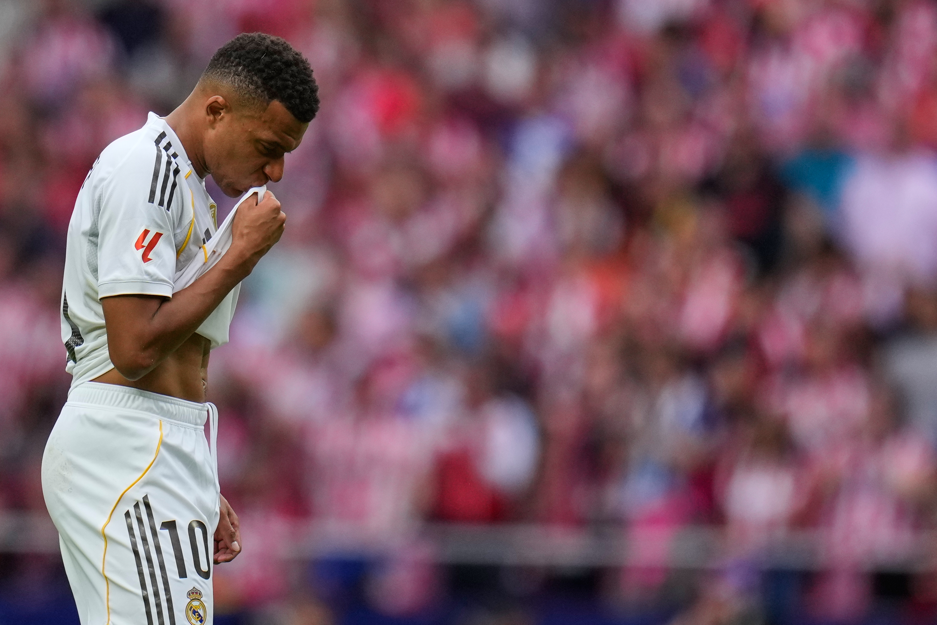 Real Madrid's Kylian Mbappe looks down during the Spanish La Liga soccer match between Atletico Madrid and Real Madrid at Metropolitano stadium, in Madrid, Spain, Saturday, Sept. 27, 2025. 