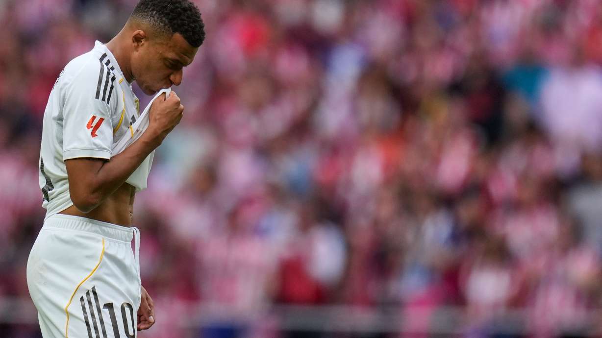 Real Madrid's Kylian Mbappe looks down during the Spanish La Liga soccer match between Atletico Madrid and Real Madrid at Metropolitano stadium, in Madrid, Spain, Saturday, Sept. 27, 2025.