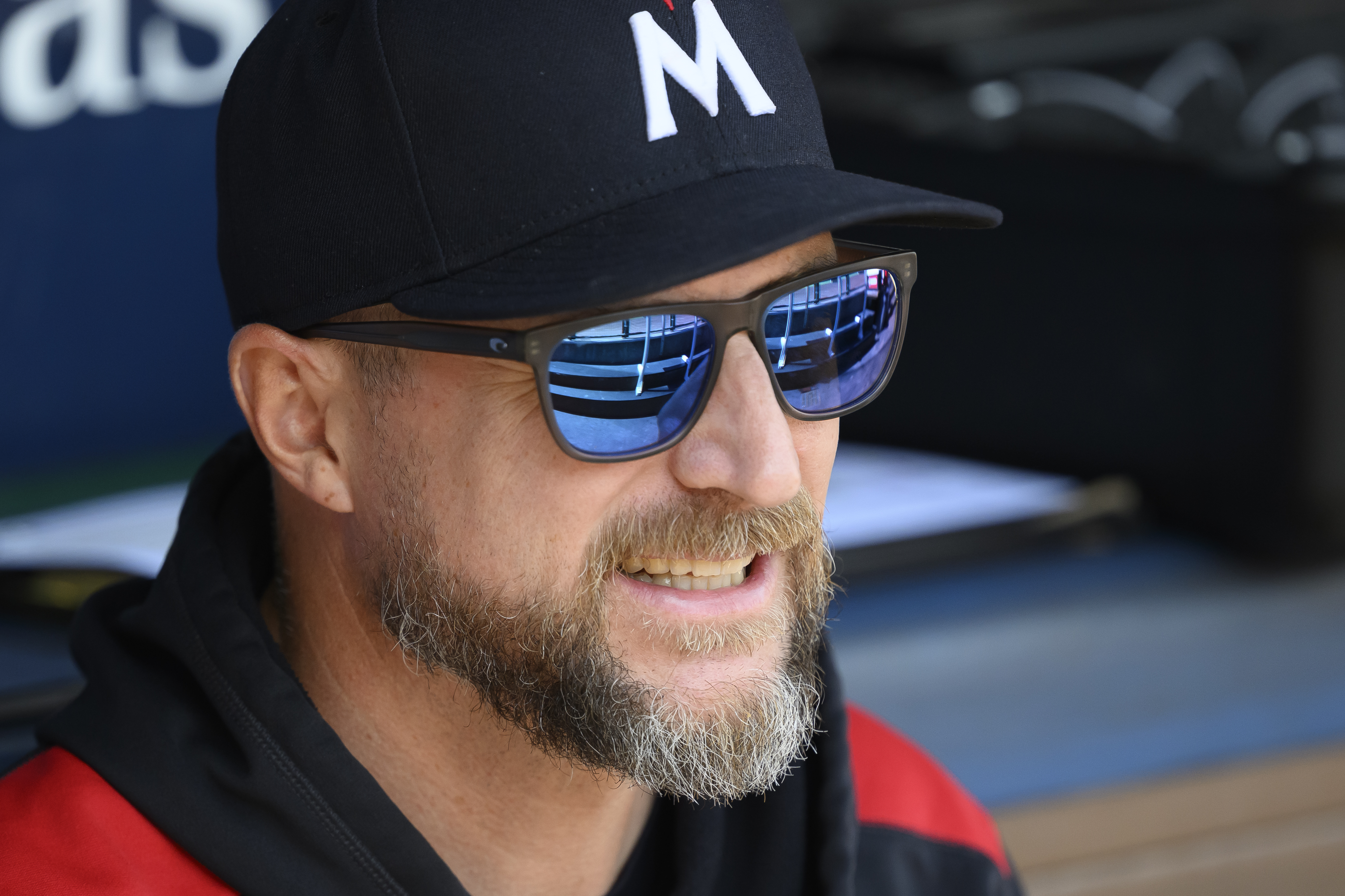 Minnesota Twins manager Rocco Baldelli talks to one of his players before a baseball game against the Kansas City Royals in Kansas City, Mo., Sunday, Sept. 7, 2025. 
