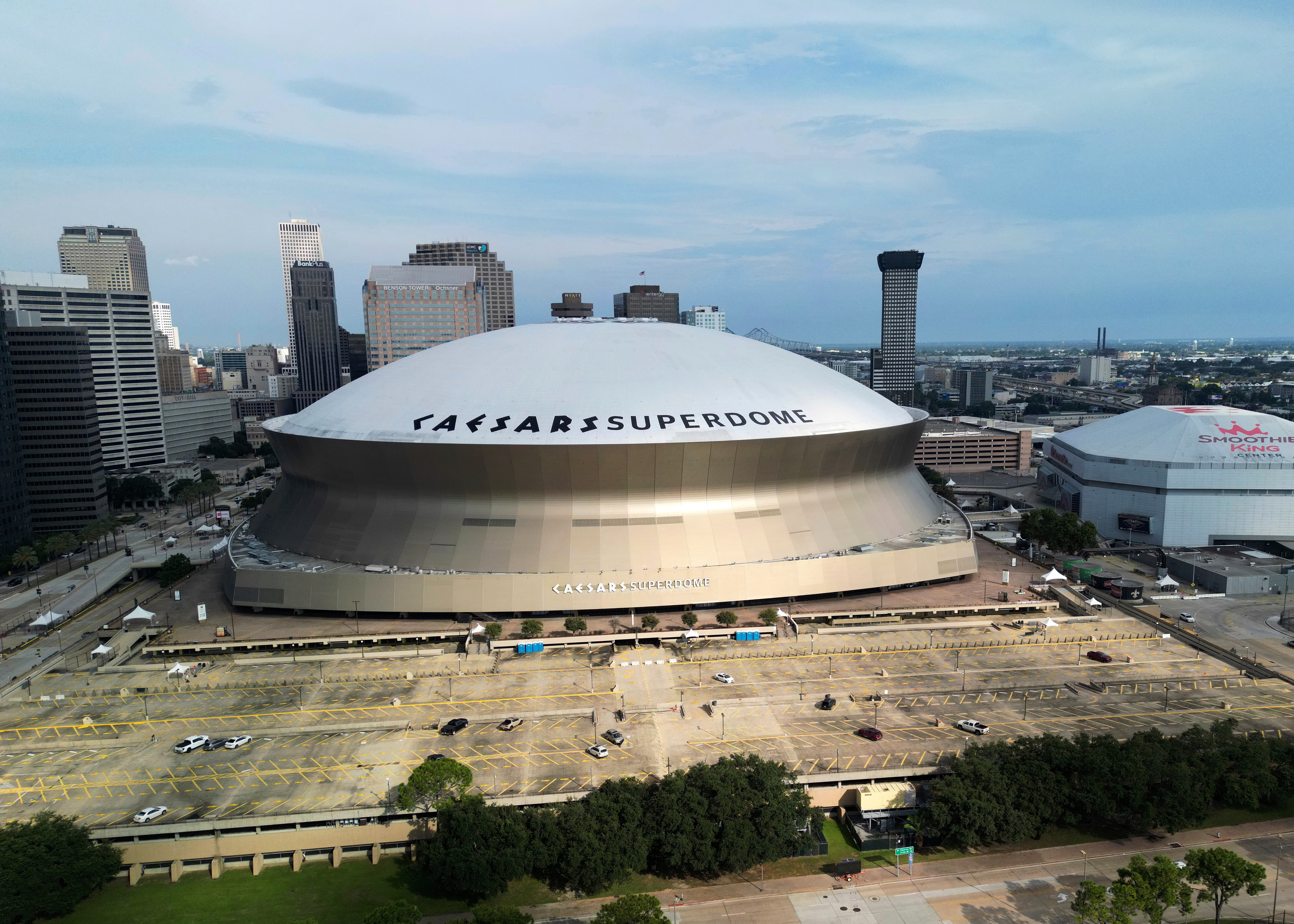 FILE - An aerial overall exterior general view of Caesars Superdome and the Smoothie King Center with the New Orleans skyline in the background is seen after an NFL preseason football game between the New Orleans Saints and the Denver Broncos in New Orleans, Saturday, Aug. 23, 2024. 