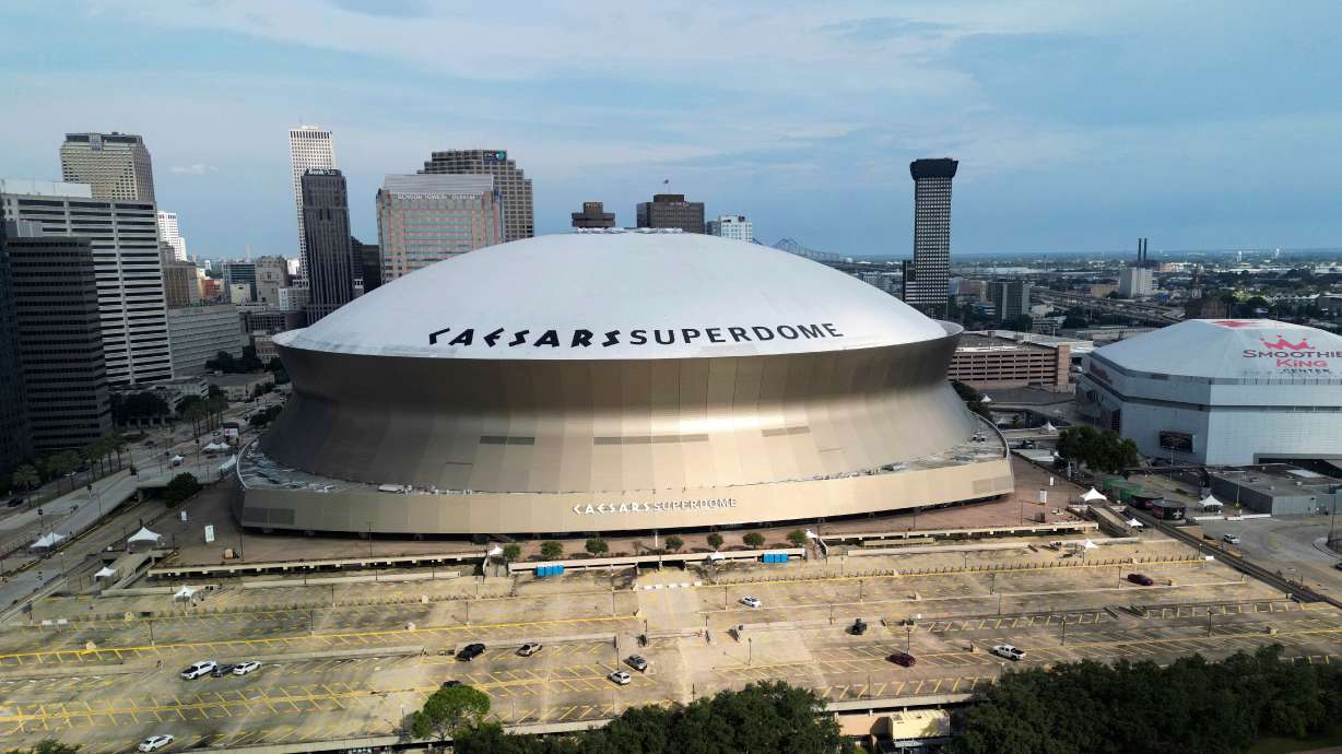 FILE - An aerial overall exterior general view of Caesars Superdome and the Smoothie King Center with the New Orleans skyline in the background is seen after an NFL preseason football game between the New Orleans Saints and the Denver Broncos in New Orleans, Saturday, Aug. 23, 2024.