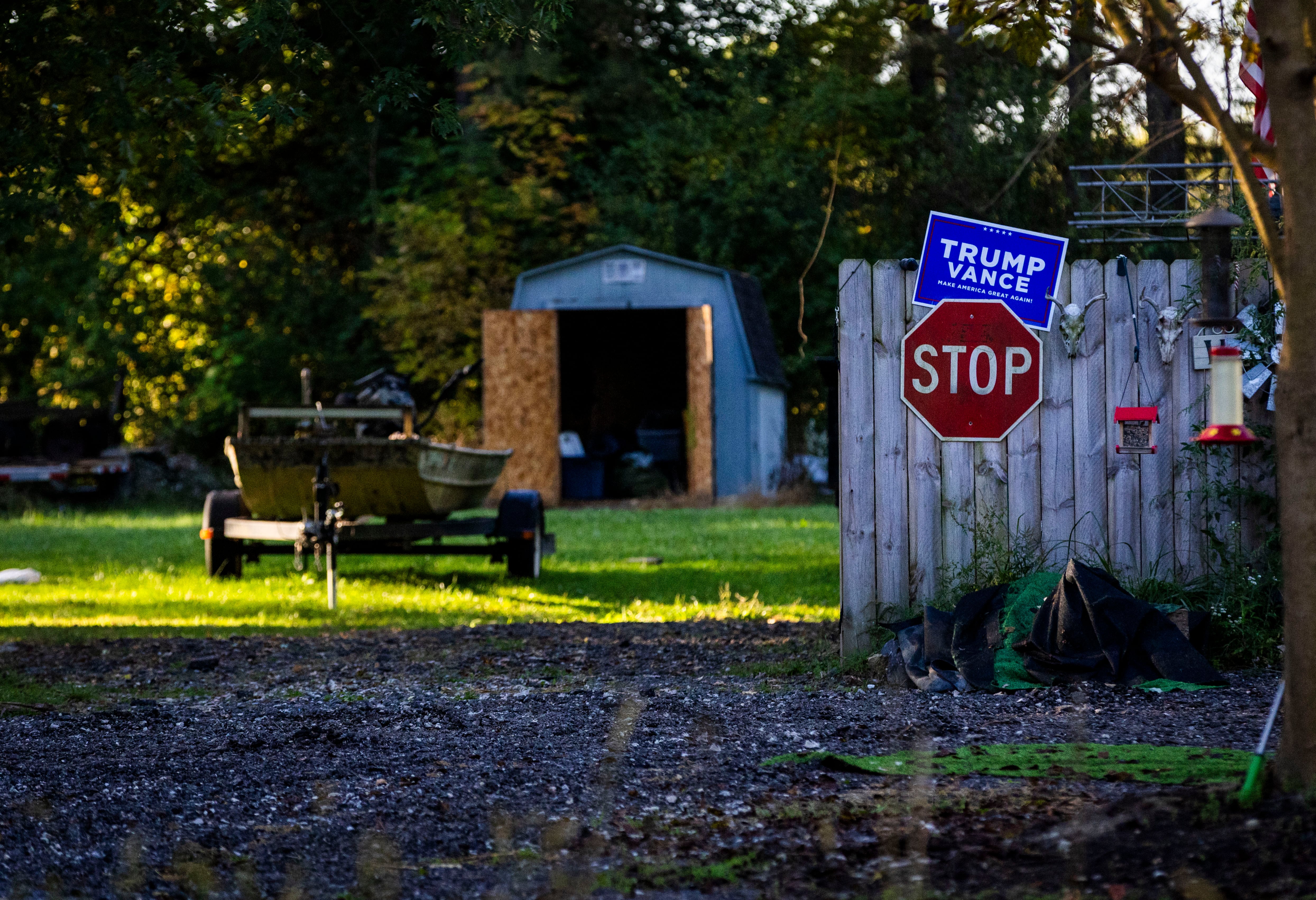 The side yard of the home of Thomas Jacob Sanford, the man identified by police as the shooter, is pictured the morning after a fire and shooting at a meetinghouse of The Church of Jesus Christ of Latter-days Saints, in Burton, Mich., on Monday.