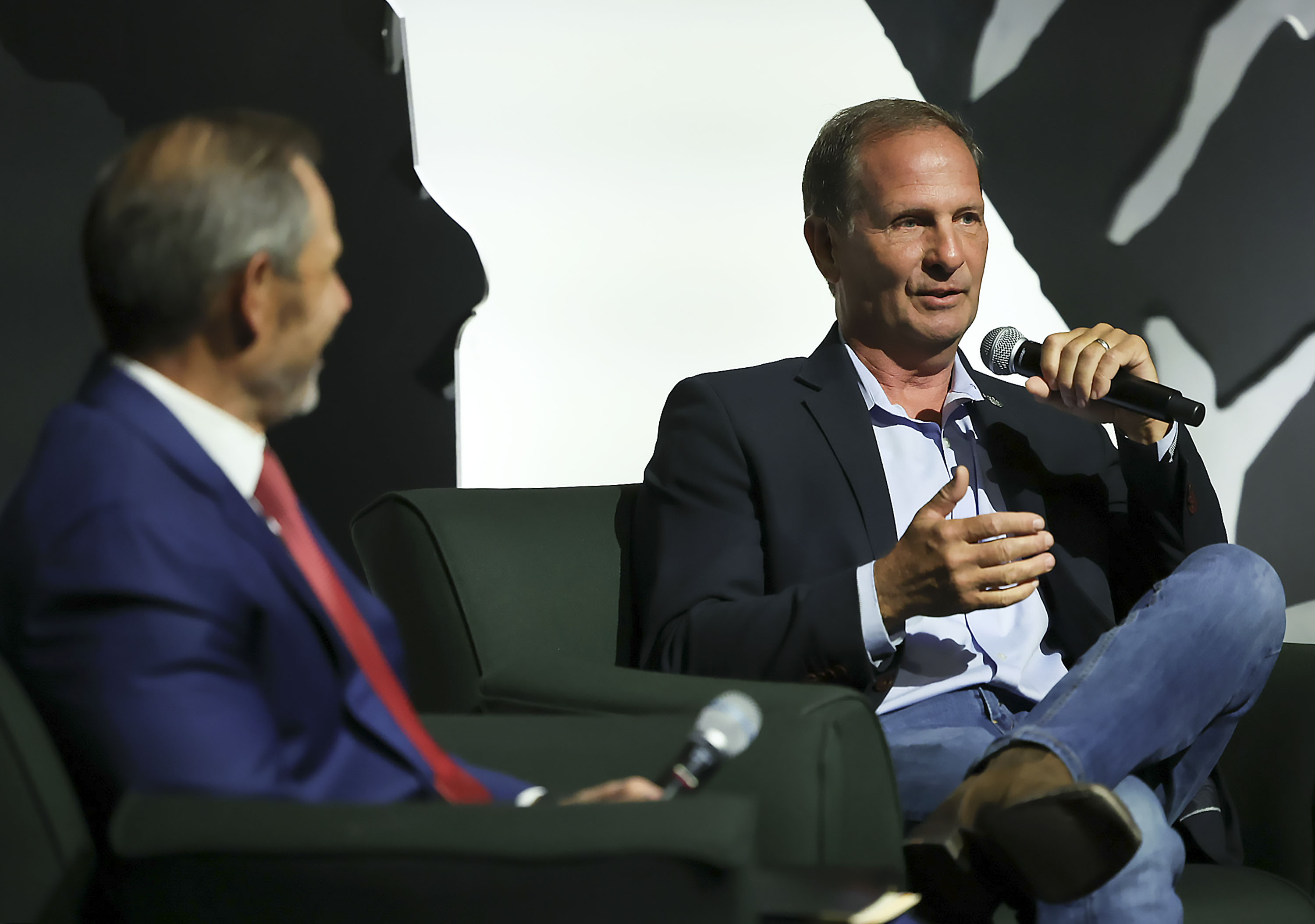 Utah Reps. John Curtis and Chris Stewart speak at Utah Valley University on Sept. 8, 2023. Venture capital firm NEXT Global Capital announced it is relocating its global headquarters to Salt Lake City and bringing on Stewart as chief strategy officer.