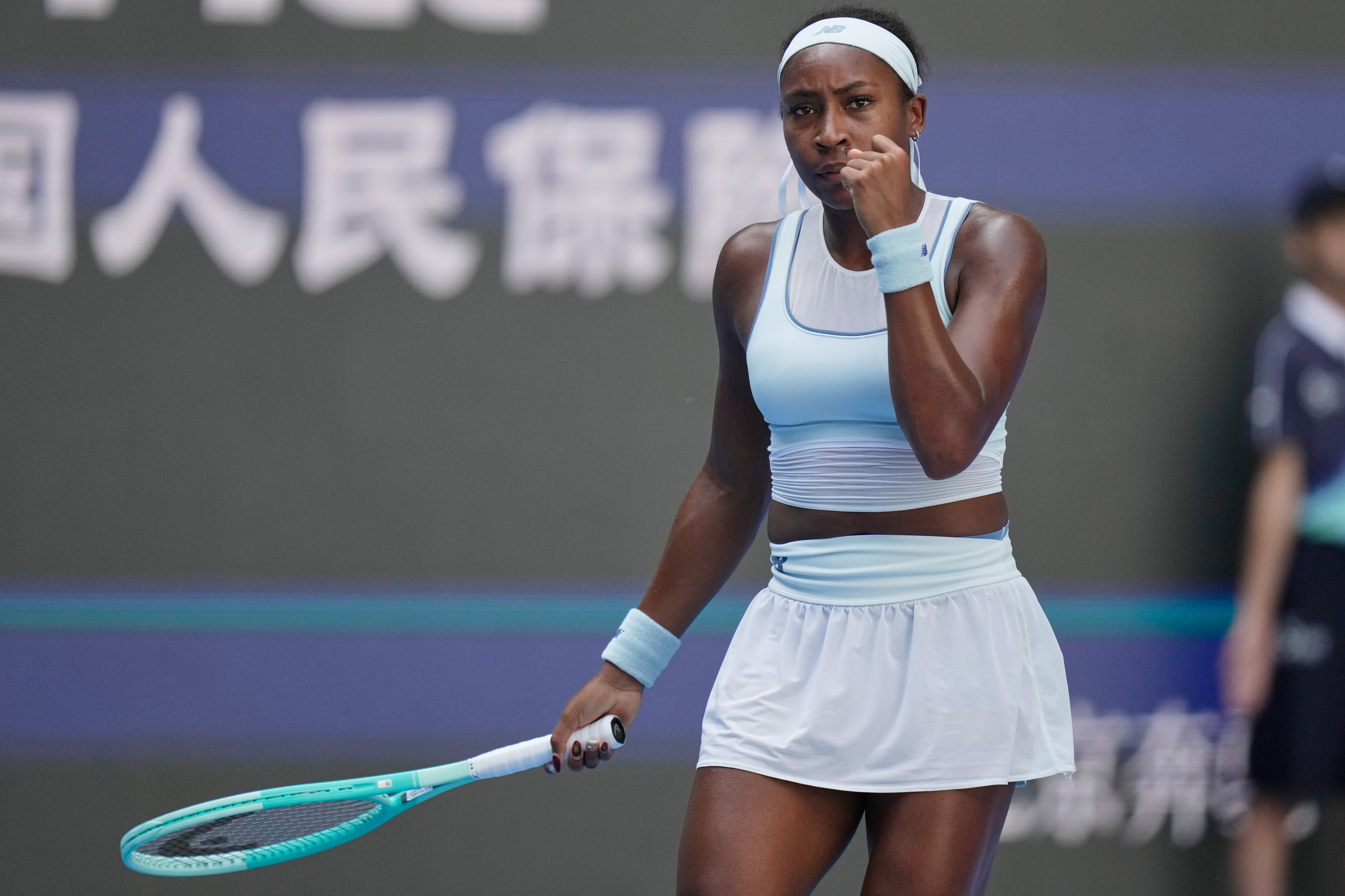 Coco Gauff of the United States reacts after scoring a point against Belinda Bencic of Switzerland during a women's singles match of the China Open tennis tournament, in Beijing, China, Tuesday, Sept. 30, 2025.