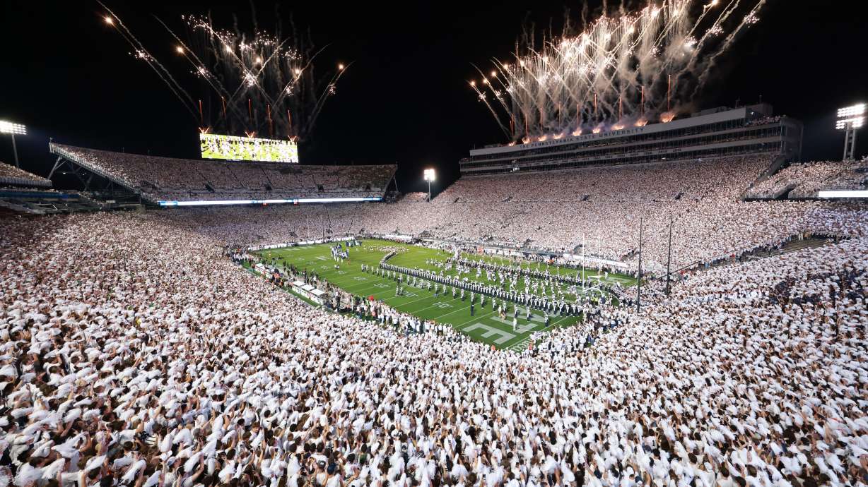 Penn State players run on to the field before an NCAA college football game against Oregon, Saturday, Sept. 27, 2025, in State College, Pa.