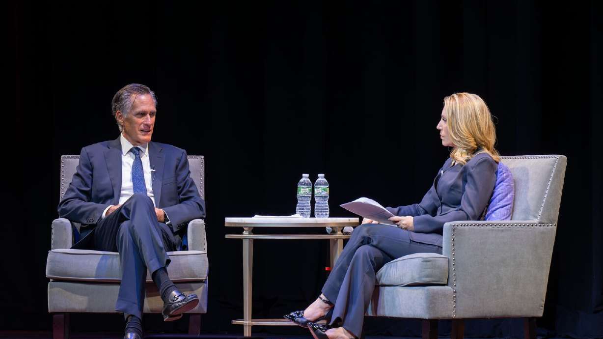 Former Sen. Mitt Romney speaks with CNN’s Dana Bash at the Mayo Performing Arts Center in Morristown, N.J., Monday. Romney blamed both parties for wielding government power against political foes.