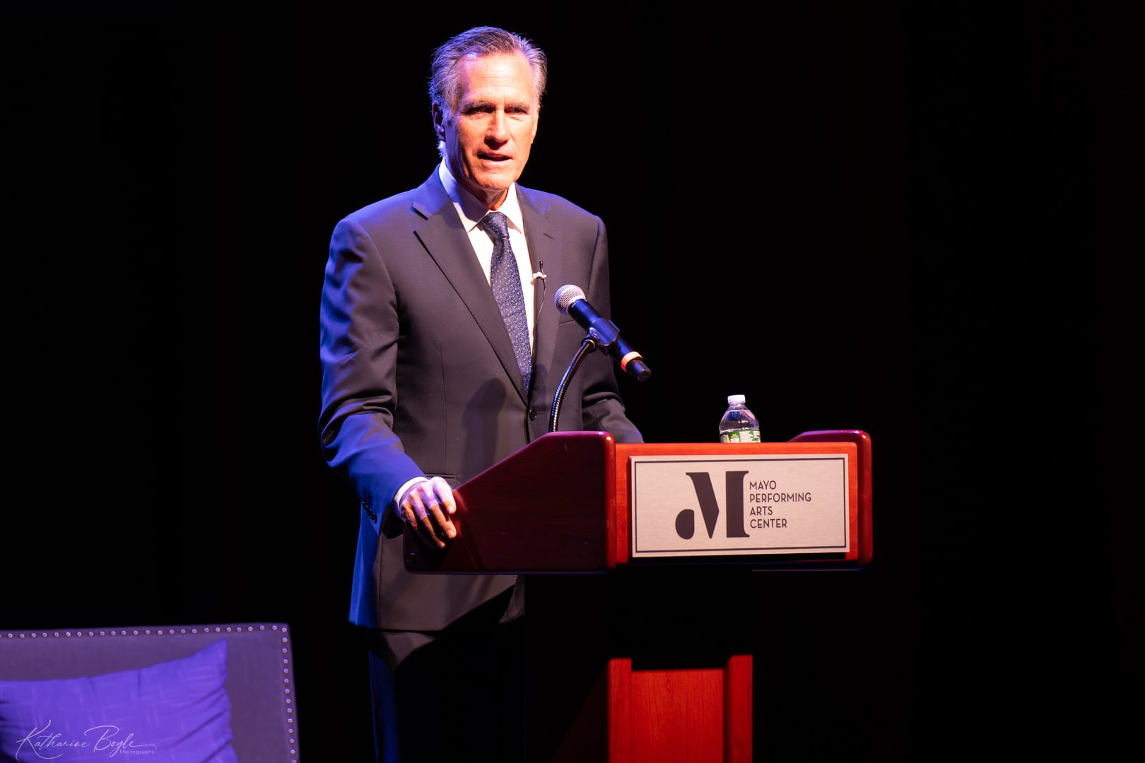 Former Sen. Mitt Romney speaks at the Mayo Performing Arts Center in Morristown, N.J., Monday. Romney called for both parties to cool their rhetoric amid a spike in political violence.