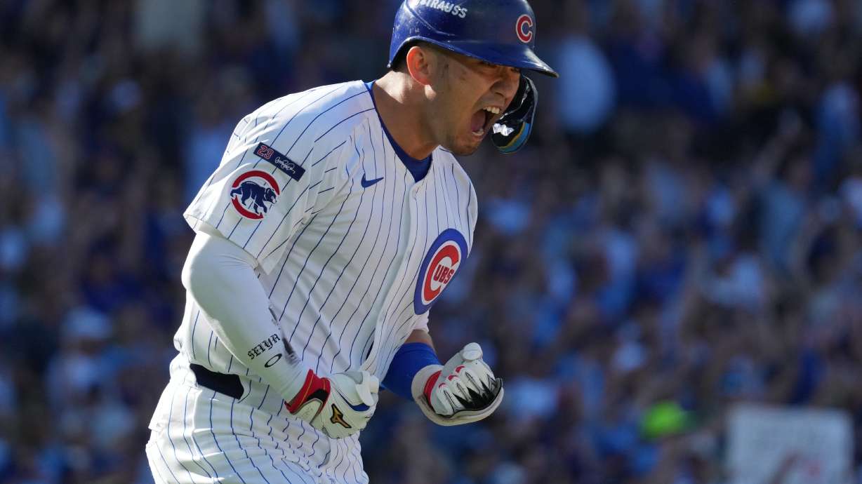 Chicago Cubs' Seiya Suzuki reacts after hitting a home run during the fifth inning of Game 1 of a National League wild card baseball game against the San Diego Padres Tuesday, Sept. 30, 2025, in Chicago.