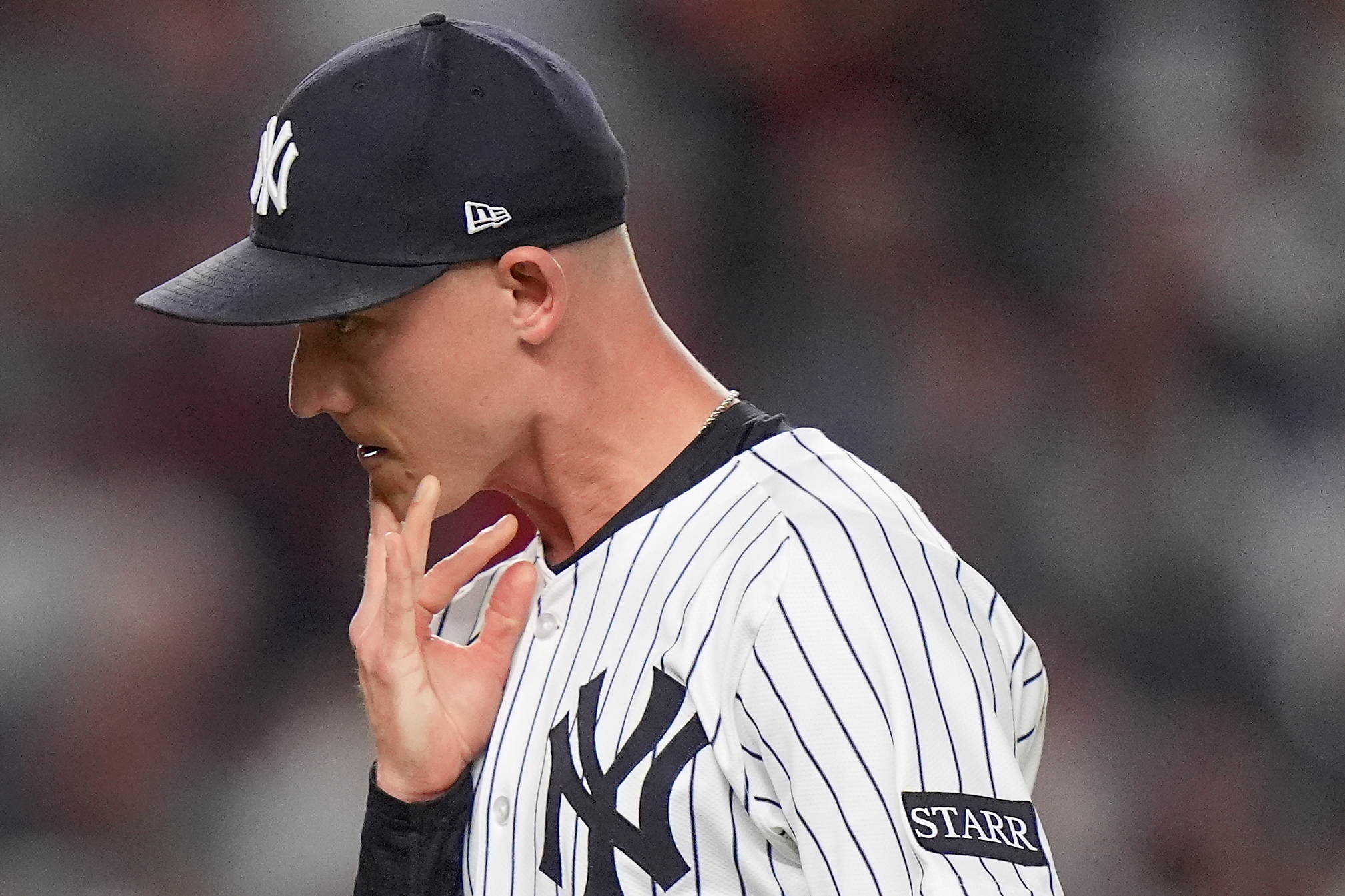 New York Yankees pitcher Luke Weaver reacts as he walks off the field after giving up two runs to the Boston Red Sox during the seventh inning of Game 1 of an American League wild-card baseball playoff series, Tuesday, Sept. 30, 2025, in New York. 