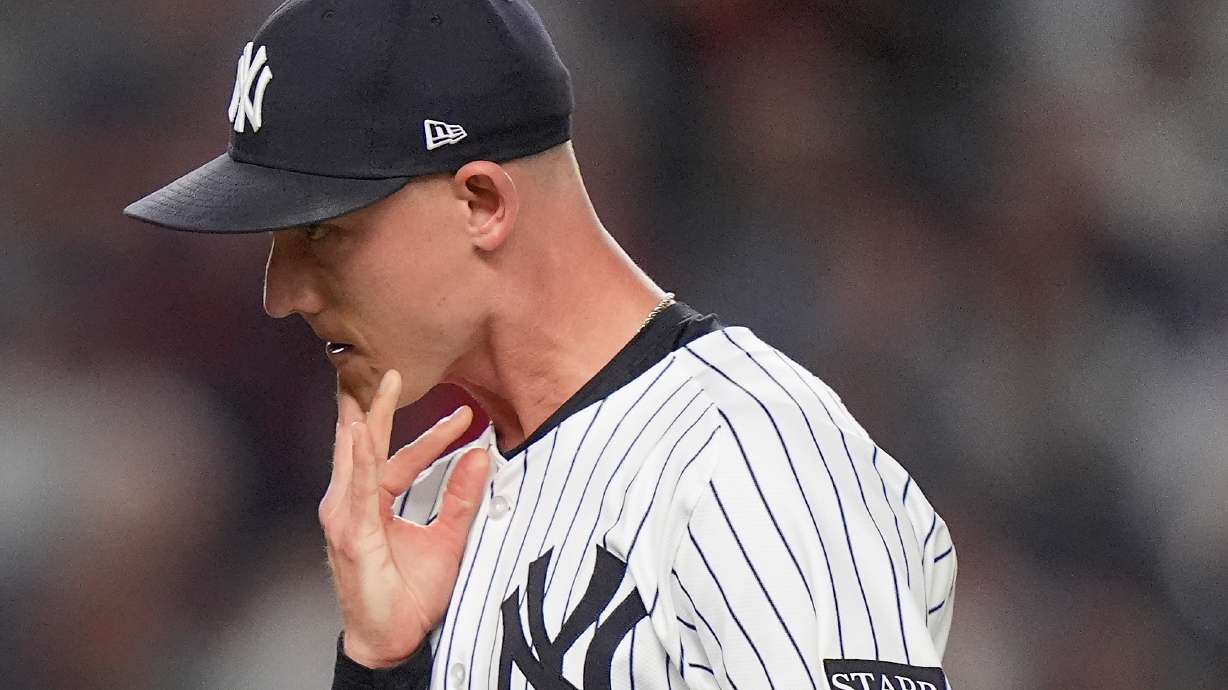 New York Yankees pitcher Luke Weaver reacts as he walks off the field after giving up two runs to the Boston Red Sox during the seventh inning of Game 1 of an American League wild-card baseball playoff series, Tuesday, Sept. 30, 2025, in New York.