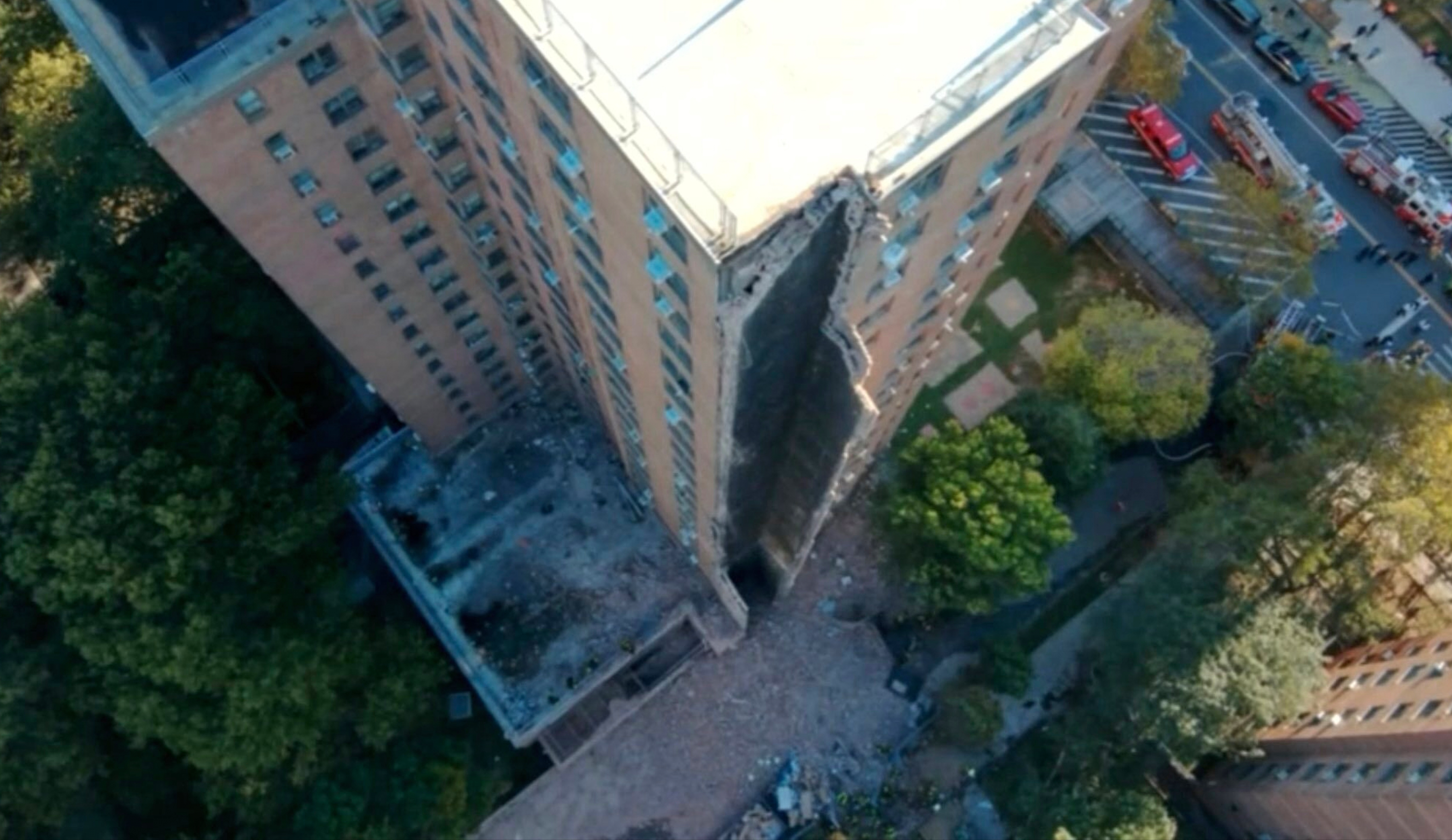 Part of a high-rise apartment building collapsed, leaving a corner of the building in a pile of rubble, in New York, Wednesday. 