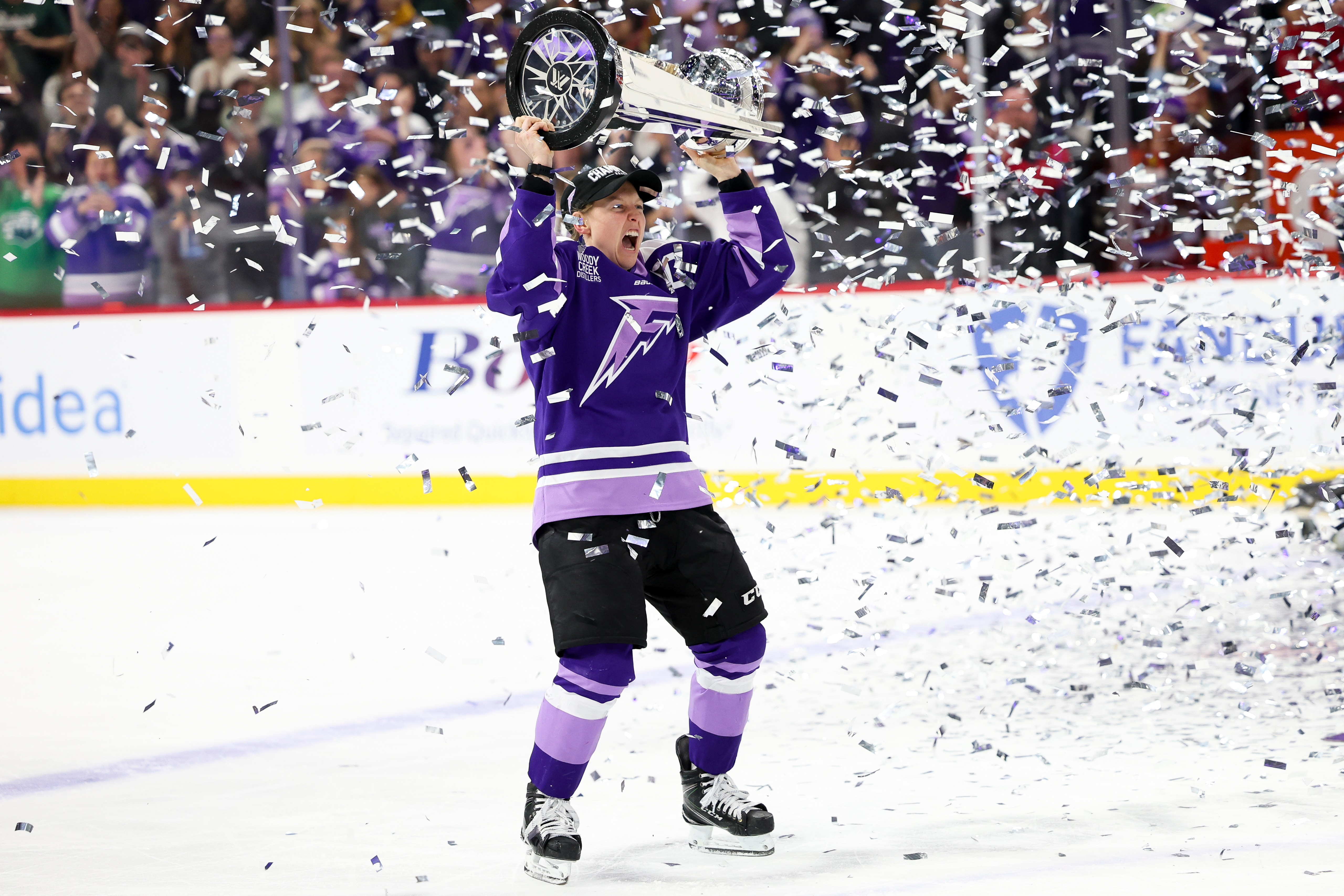 FILE - Minnesota Frost forward Kendall Coyne Schofield celebrates with the Walter Cup after her team won the PWHL hockey finals against the Ottawa Charge, May 26, 2025, in St. Paul, Minn. 