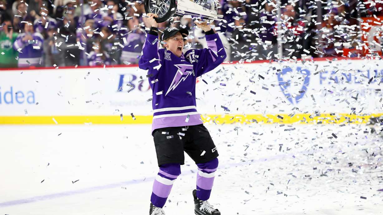 FILE - Minnesota Frost forward Kendall Coyne Schofield celebrates with the Walter Cup after her team won the PWHL hockey finals against the Ottawa Charge, May 26, 2025, in St. Paul, Minn.