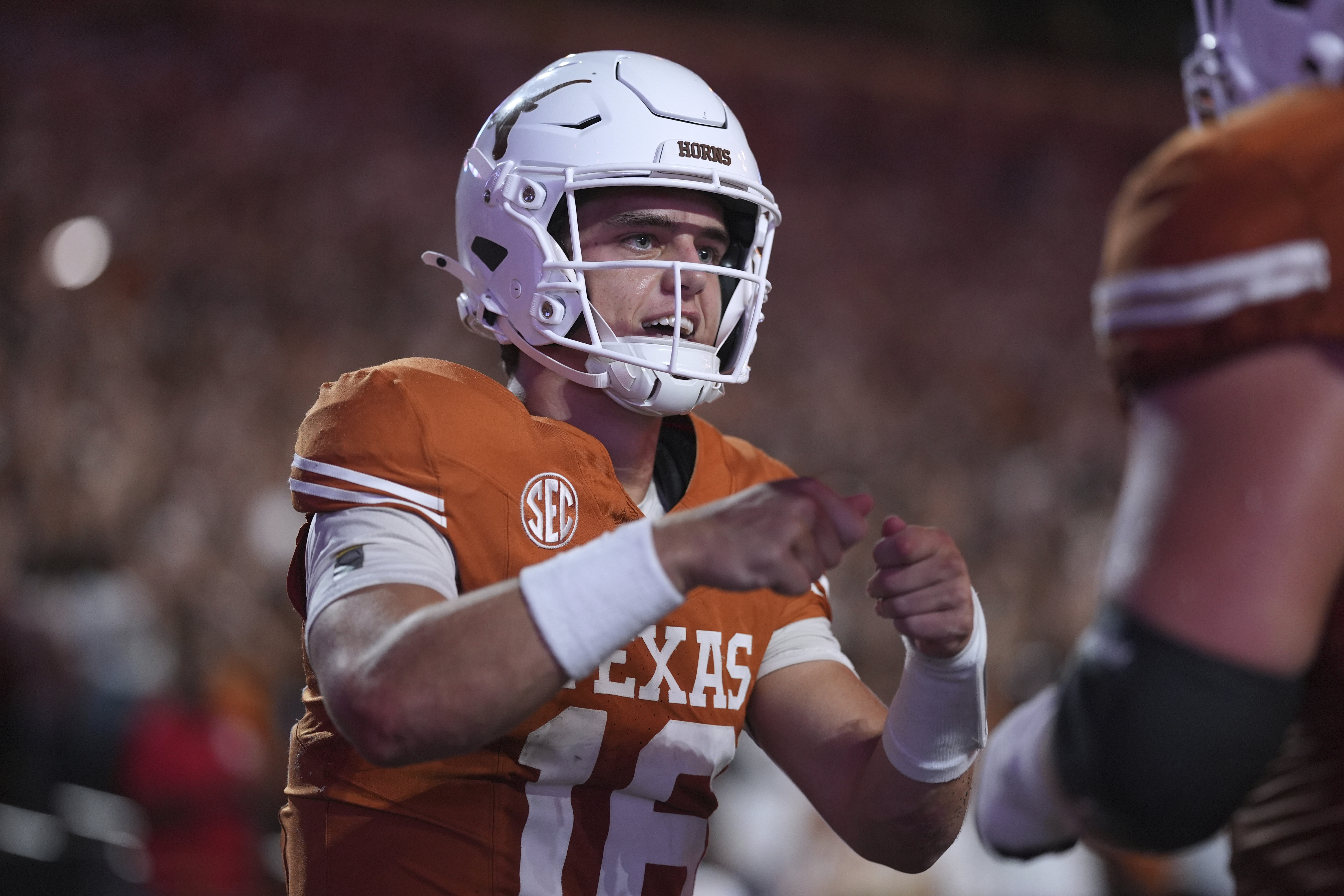 Texas quarterback Arch Manning (16) celebrates with teammates after he scored a touchdown against Sam Houston State during the first half of an NCAA college football game in Austin, Texas, Saturday, Sept. 20, 2025. 