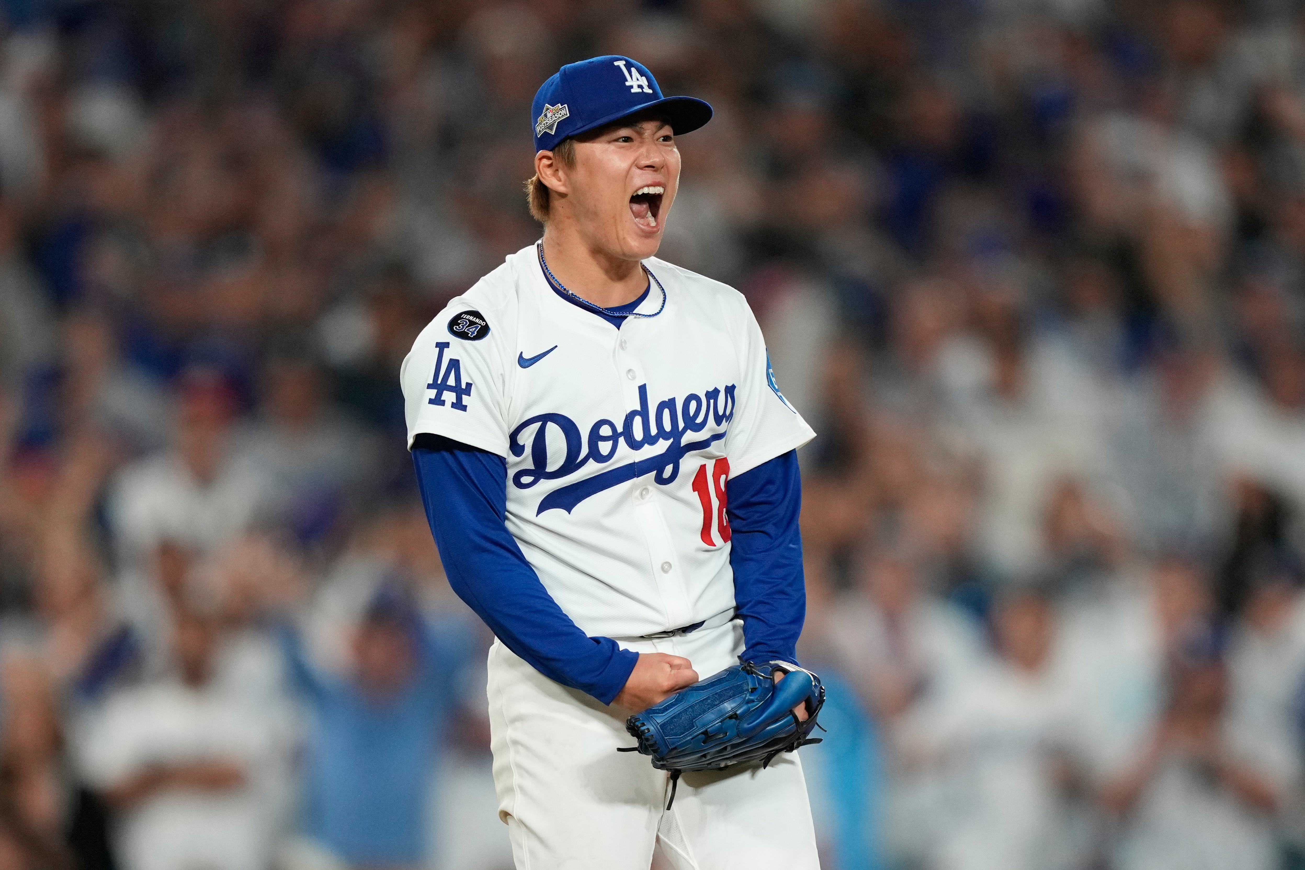 Los Angeles Dodgers pitcher Yoshinobu Yamamoto reacts after striking out Cincinnati Reds' Elly De La Cruz during the sixth inning in Game 2 of the National League Wild Card baseball playoff series Wednesday, Oct. 1, 2025, in Los Angeles. 