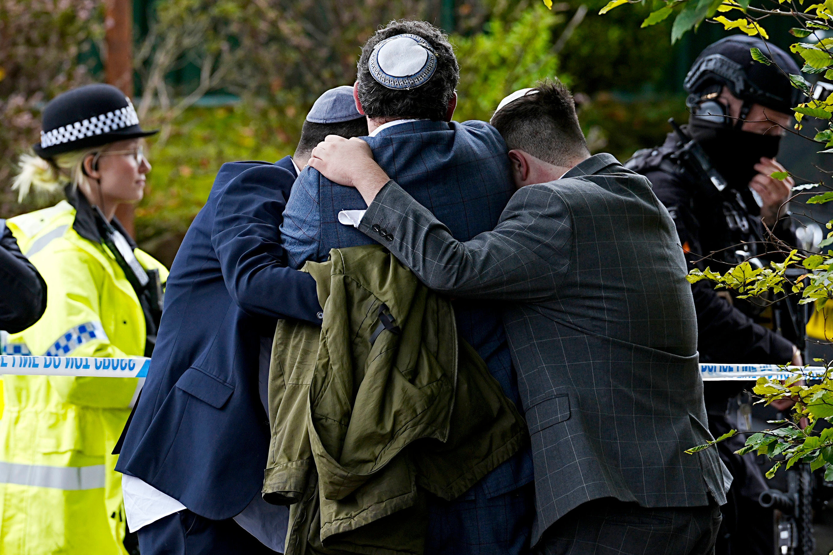 Members of the Jewish community near the Heaton Park synagogue, in Crumpsall, Manchester, England, Thursday. An assailant killed two people and wounded four others in what police described as a terrorist attack on the synagogue.