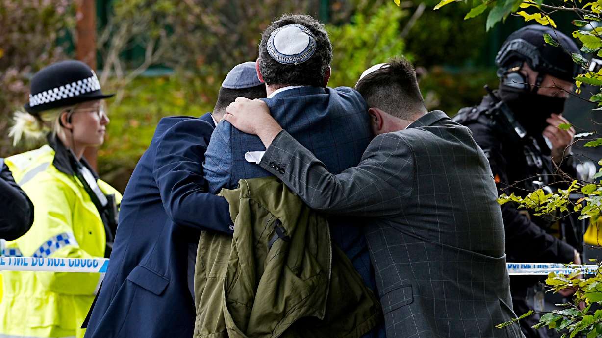 Members of the Jewish community near the Heaton Park synagogue, in Crumpsall, Manchester, England, Thursday. An assailant killed two people and wounded four others in what police described as a terrorist attack on the synagogue.