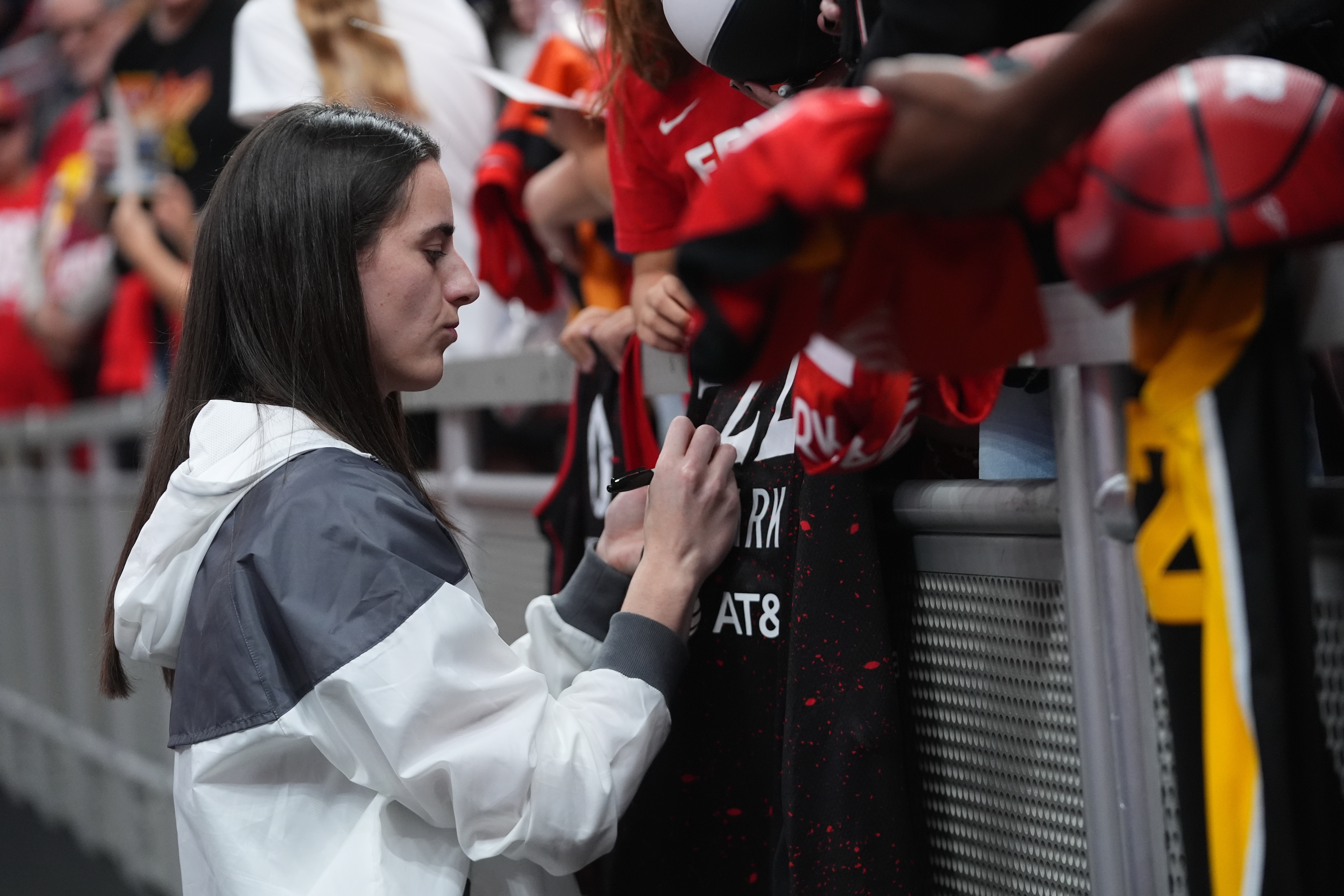 Indiana Fever's Caitlin Clark signs autographs before Game 3 of a WNBA basketball playoff semifinals series against the Las Vegas Aces, Friday, Sept. 26, 2025, in Indianapolis. 