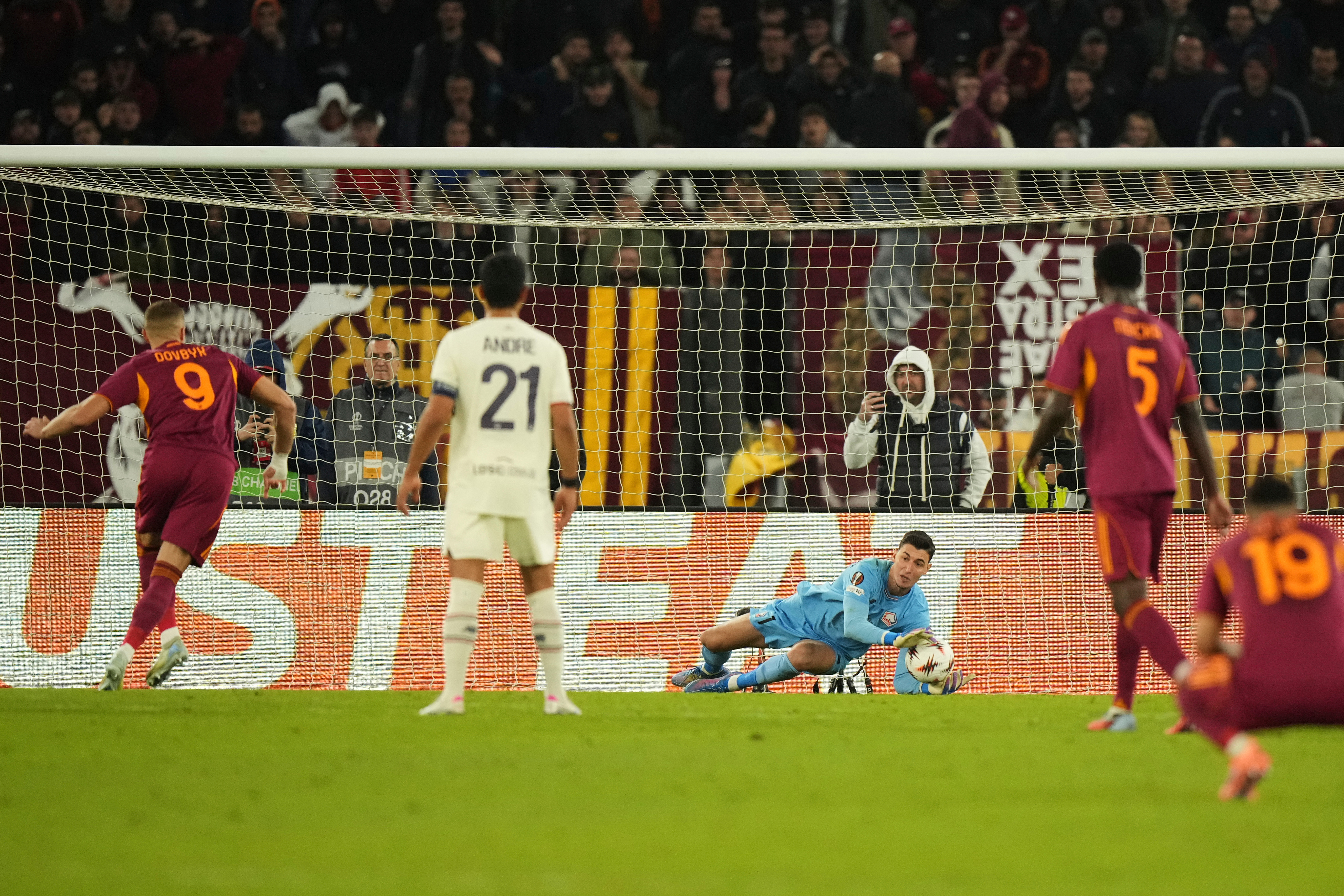 Lille goalkeeper Mile Svilar saves a penalty kicked by Roma's Artem Dovbyk during the Europa League Europa League soccer match between AS Roma and Lille at the Olympic stadium in Rome, Thursday, Oct. 2, 2025.