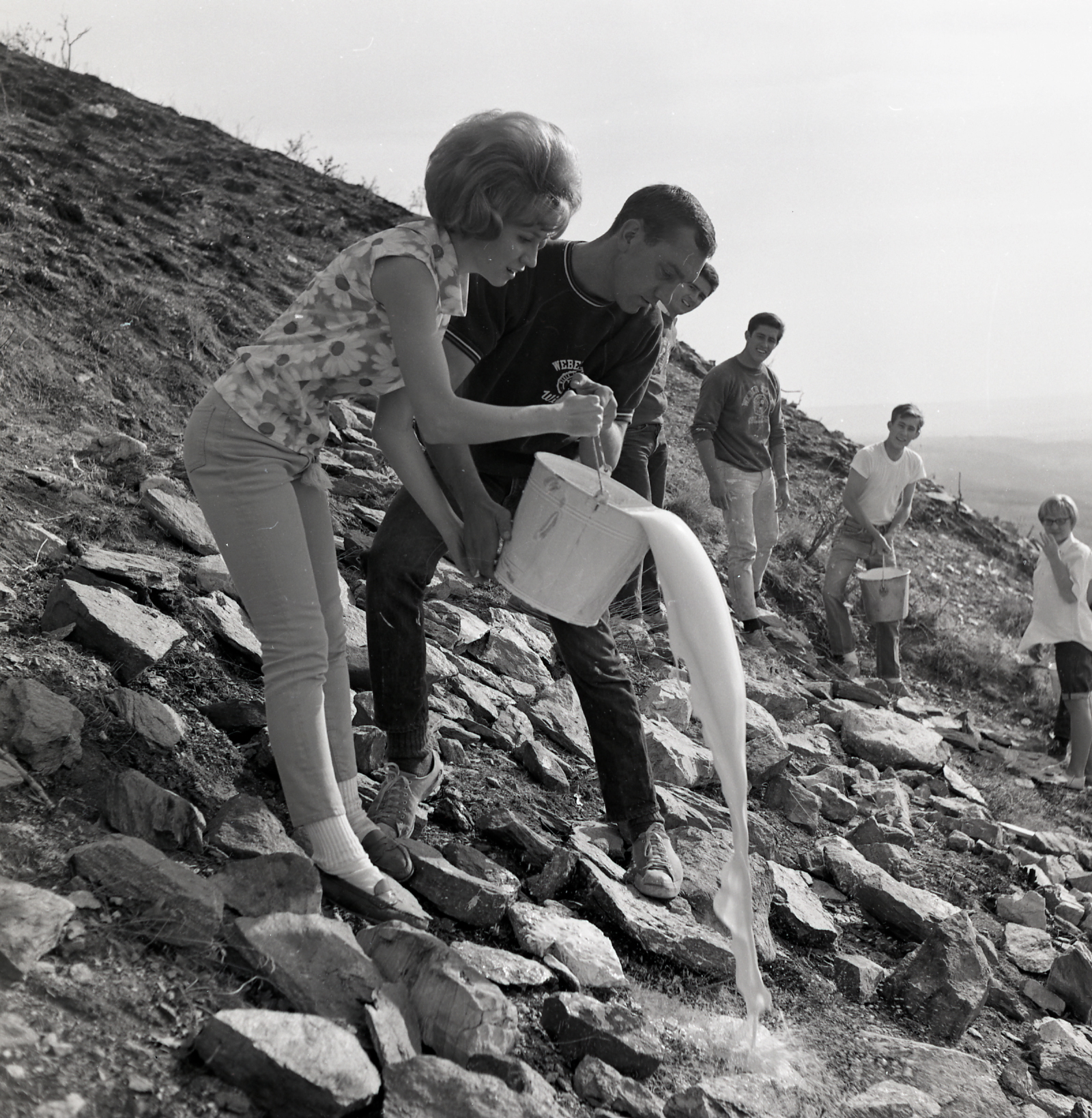 Students whitewash rocks above the campus to create a prior incarnation of the W in 1967. Weber State University on Sept. 20, publicly unveiled a new solar-powered W on the mountain above the Ogden-based university.