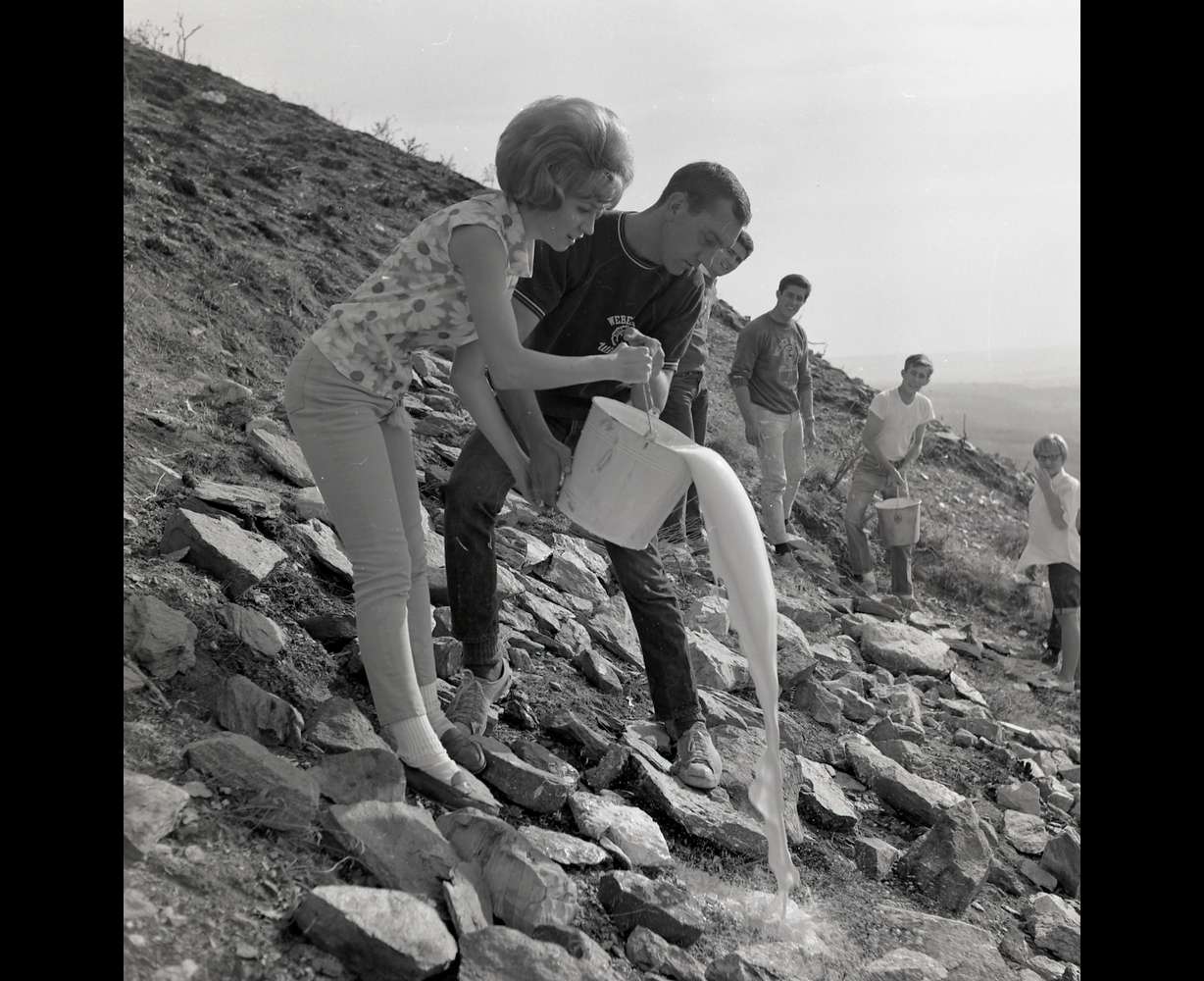 Students whitewash rocks above the campus to create a prior incarnation of the W in 1967. Weber State University on Sept. 20, publicly unveiled a new solar-powered W on the mountain above the Ogden-based university.