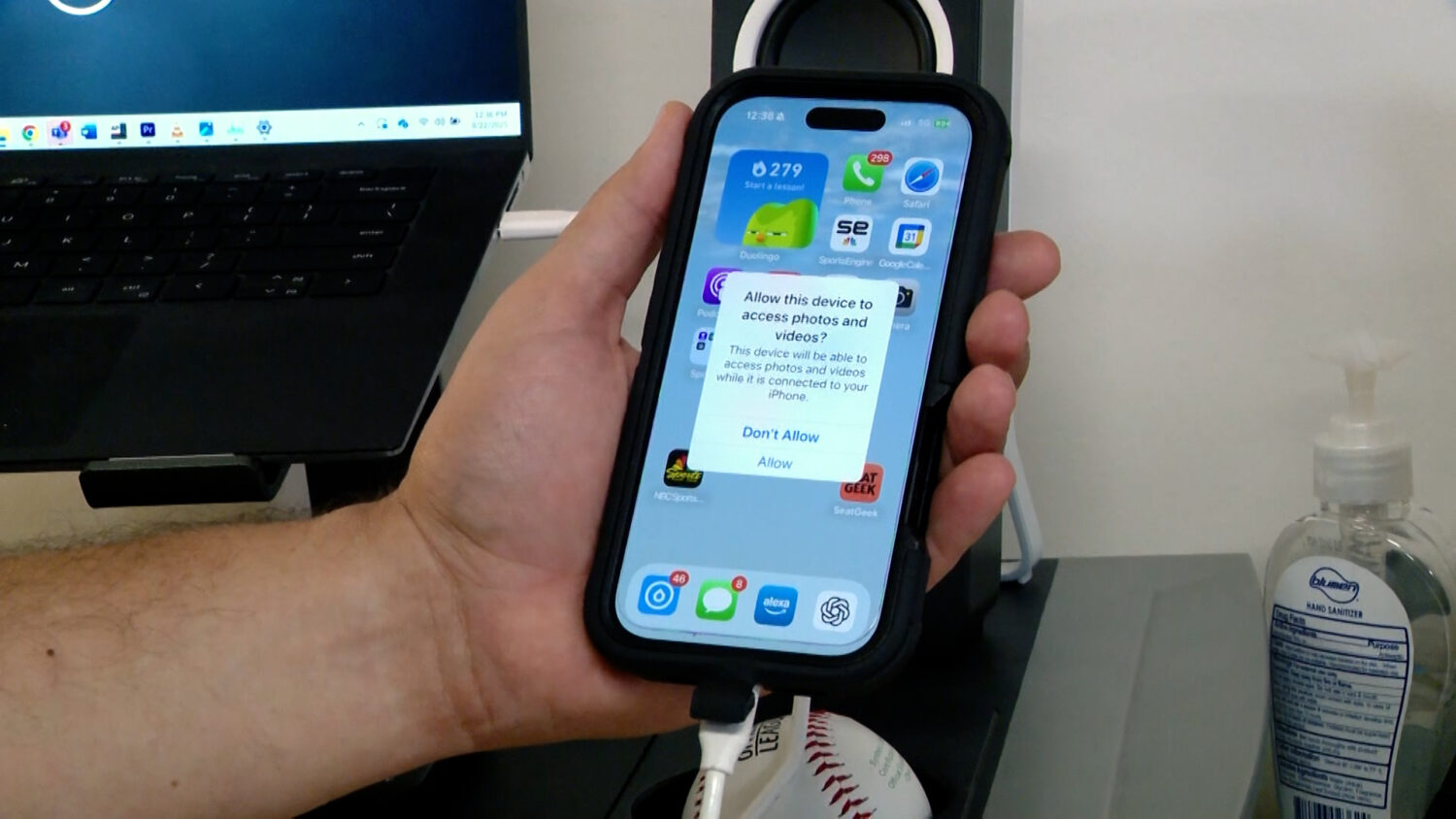 A prompt asking a user to allow access to their iPhone's photos and videos. The latest Apple and Android OS software have built-in protections against juice jacking that require you to give a USB port such permission to access your device.