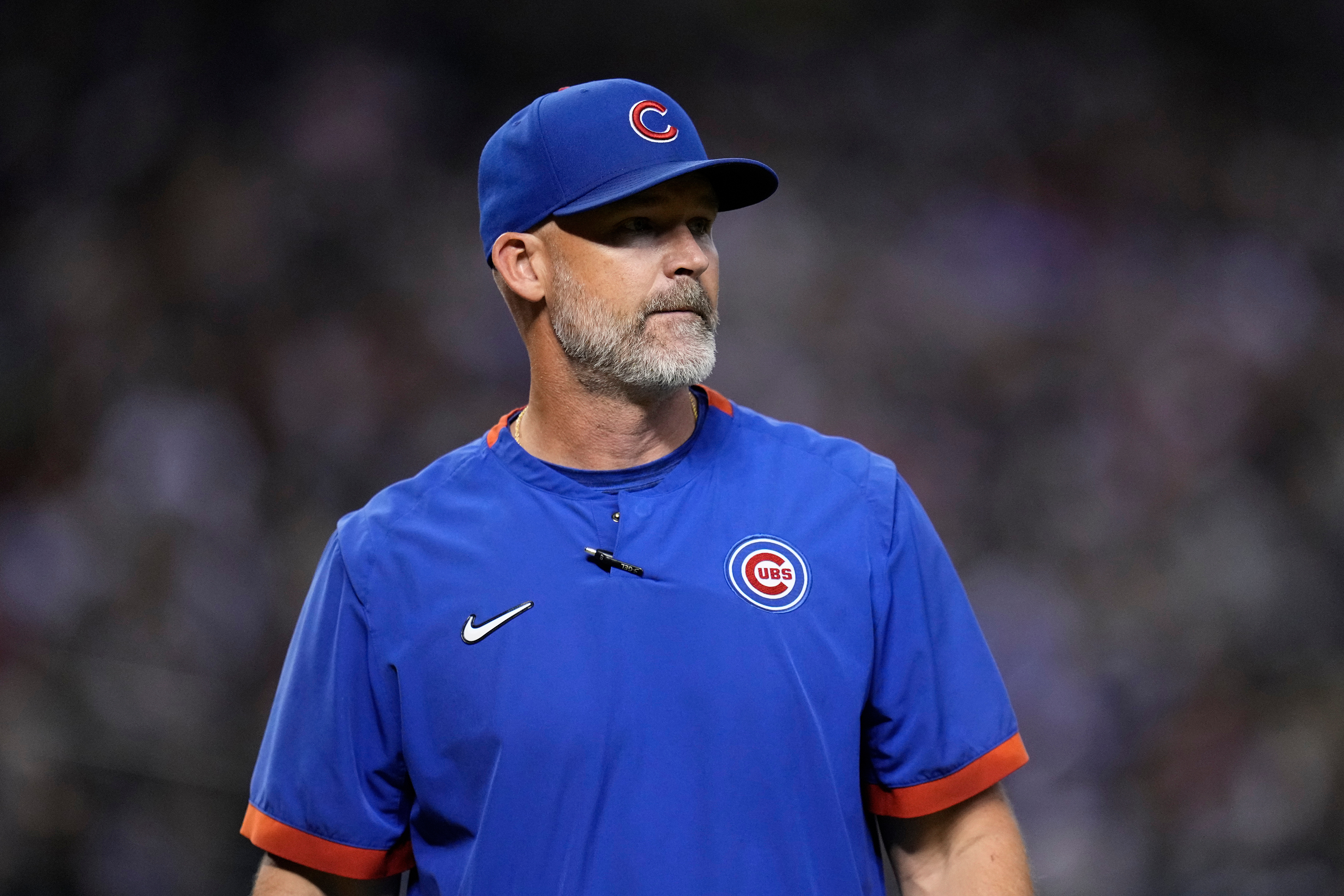 FILE - Chicago Cubs manager David Ross walks back to the dugout during the 10th inning of a baseball game against the Arizona Diamondbacks, Sept. 16, 2023, in Phoenix.