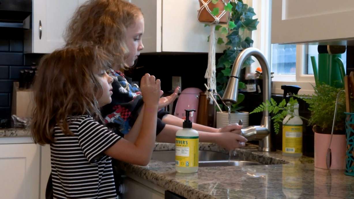 Tracy Keck’s kids, including her 9-year-old daughter, Prudence, washing their hands before eating lunch, Thursday. The Keck family takes being well seriously.