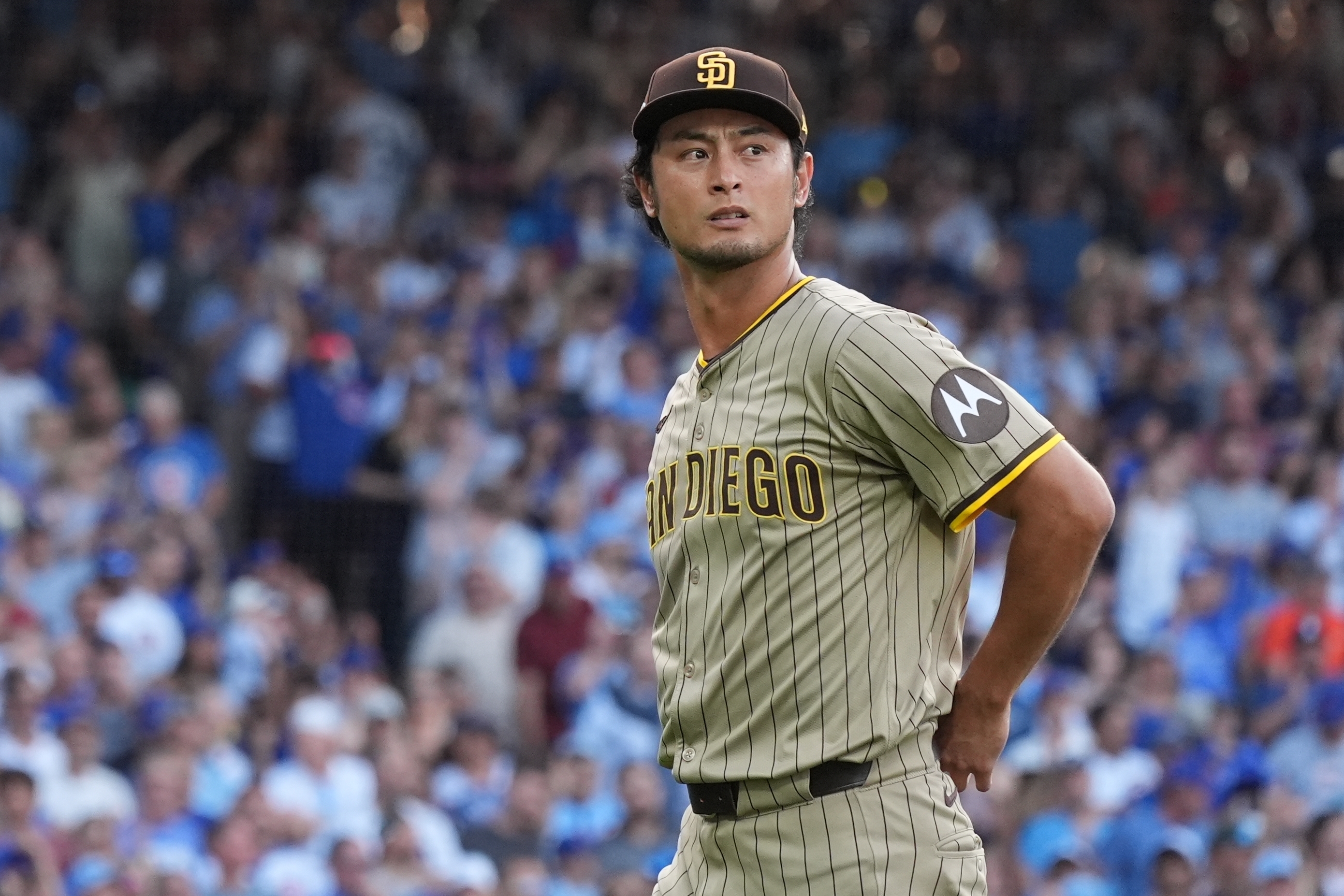 San Diego Padres' Yu Darvish leaves the game during the second inning of Game 3 of a National League wild card baseball game against the Chicago Cubs Thursday, Oct. 2, 2025, in Chicago. 
