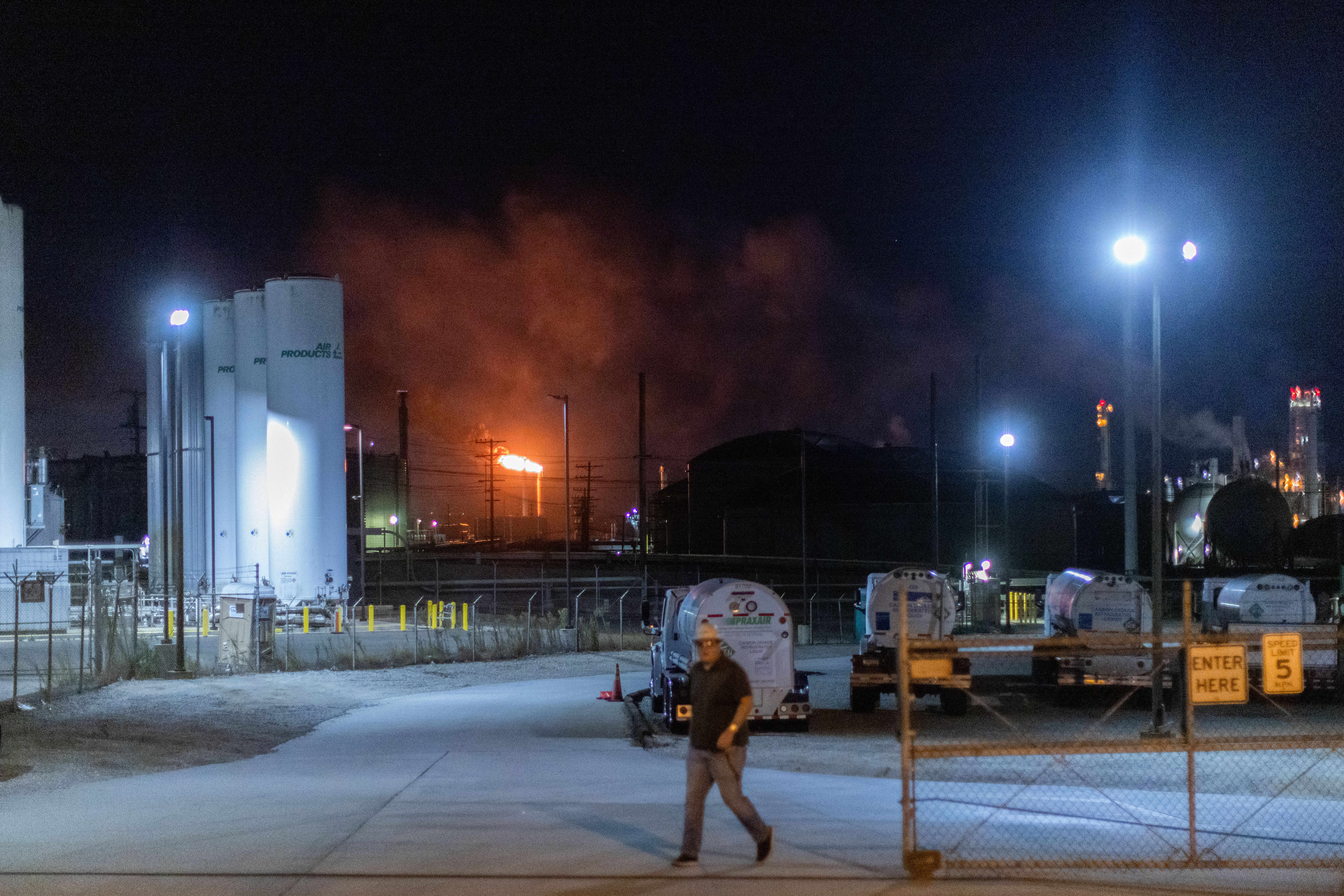 Flames rise from the Chevron refinery in El Segundo, Calif., Thursday. Officials said the fire was contained to one section of the refinery.