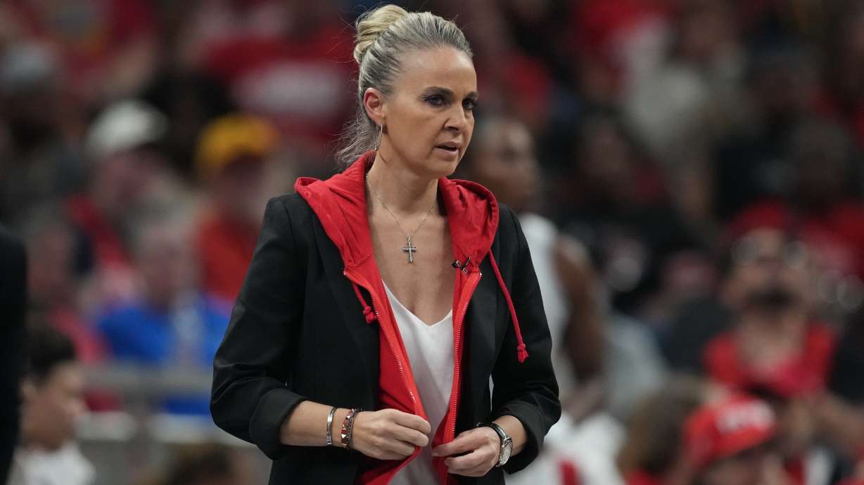 Las Vegas Aces head coach Becky Hammon watches during first half of Game 3 of a WNBA basketball playoff semifinals series against the Indiana Fever, Friday, Sept. 26, 2025, in Indianapolis.